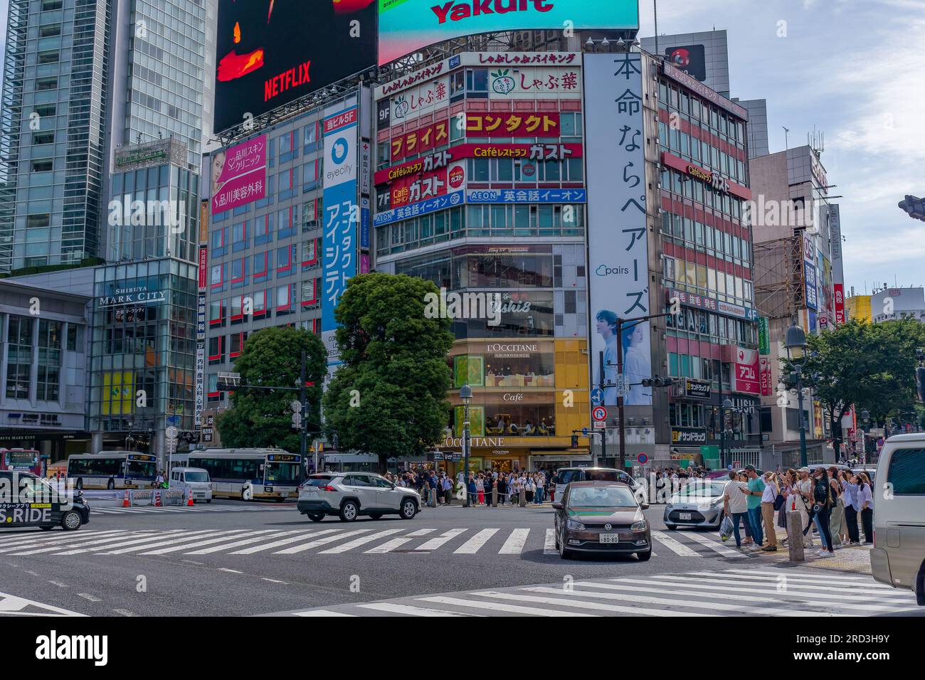 TOKYO, JAPAN - JUNE 21 2023: Large crowds using the famous Shibuya Crossing in a busy shopping area of Tokyo, Japan. Stock Photo