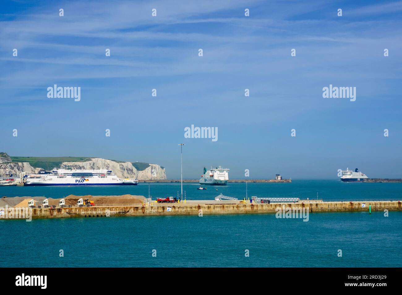 P&O Ferry, Irish Ferry and DFDS Ferry with white cliffs beyond in busy English Channel port. Dover, Kent, England, UK, Britain Stock Photo