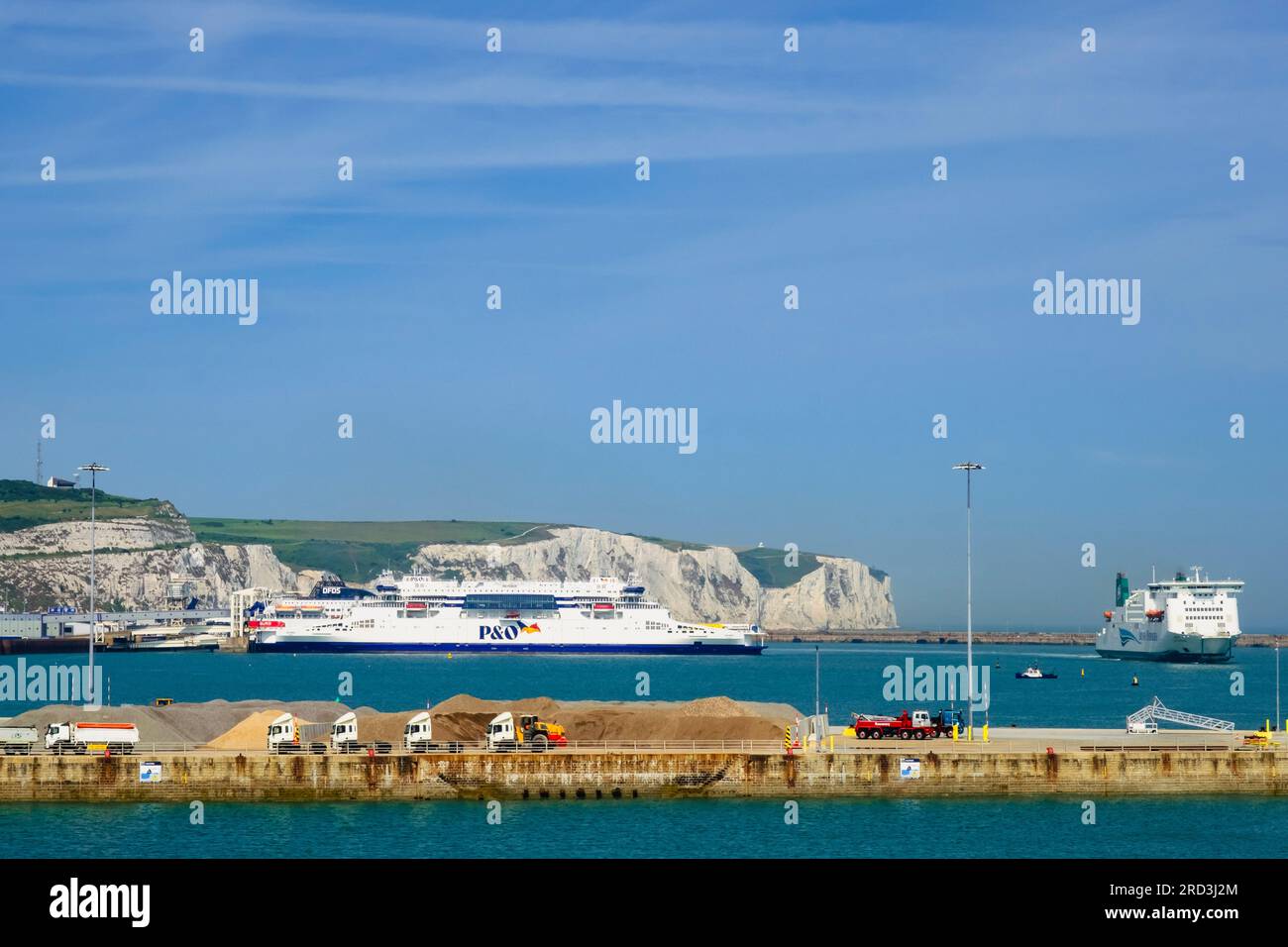 P&O Ferry and Irish Ferry with white cliffs beyond in busy English Channel port. Dover, Kent, England, UK, Britain Stock Photo