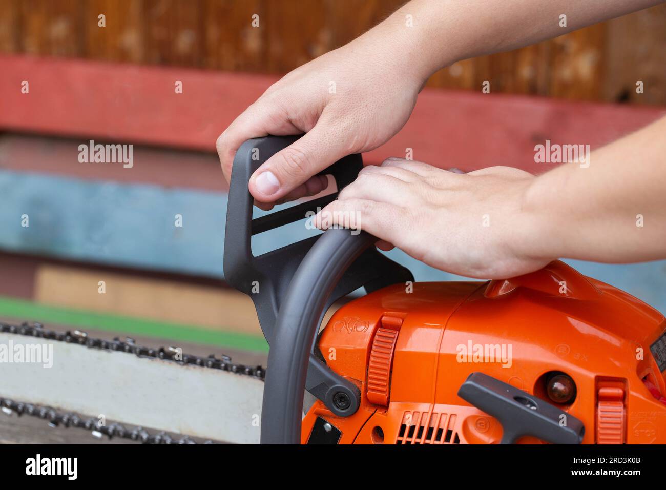 The process of activating the chain brake in a chainsaw before starting
