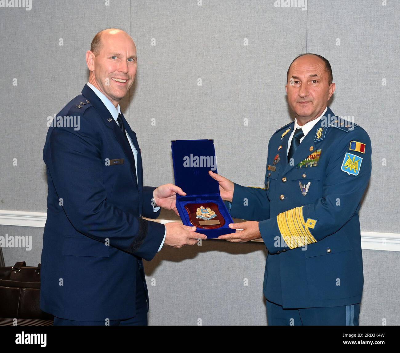Air National Guard Assistant to the Secretary of the Air Force, International Affairs (SAF/IA), Maj. Gen. Troy Daniels (left) receives a gift from Chief of the Romanian Air Force Staff Lt. Gen. Viorel Pană during a meeting at the Pentagon, Arlington, Va., June 27, 2023. Stock Photo