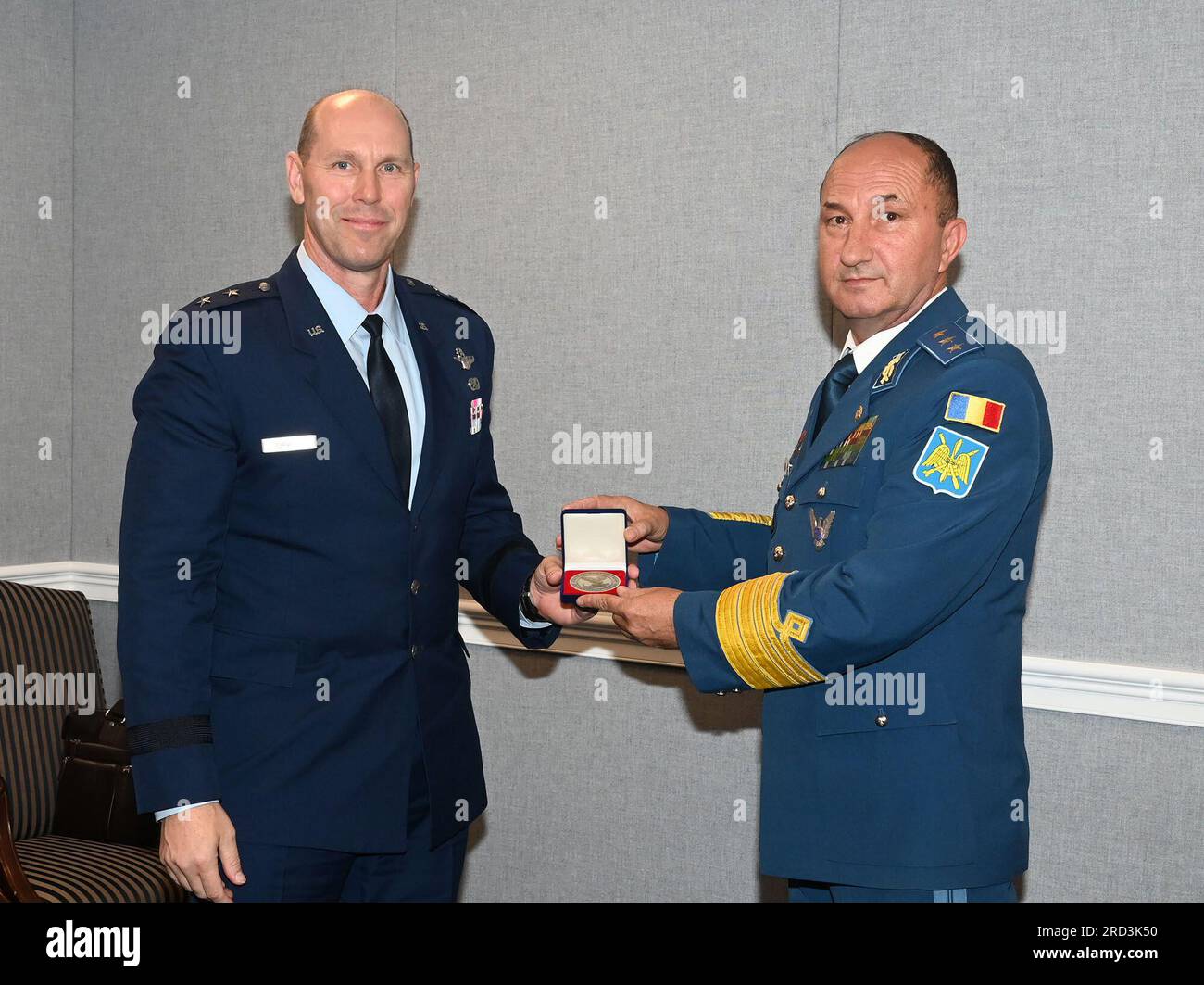 Air National Guard Assistant to the Secretary of the Air Force, International Affairs (SAF/IA), Maj. Gen. Troy Daniels (left) presents a gift to Chief of the Romanian Air Force Staff Lt. Gen. Viorel Pană during a meeting at the Pentagon, Arlington, Va., June 27, 2023. Stock Photo