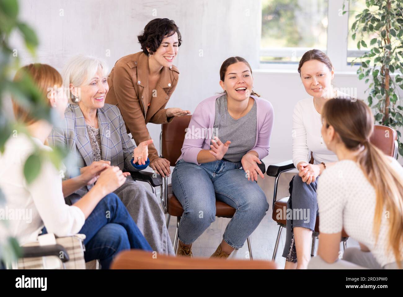 in group lesson, students are animatedly discussing ways to perform ...