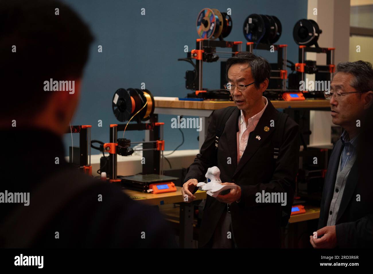 Hisao Nairo, mayor of Nirasaki, Japan, holds a 3D print during a base tour at the Phoenix Spark Innovation Lab at Travis Air Force Base, California, June 27, 2023. The tour is part of the Sister City Program between the City of Fairfield, Calif., and Nirasaki, Japan. It provides the Japanese visitors a better understanding of the partnership between the City of Fairfield and the installation. Stock Photo