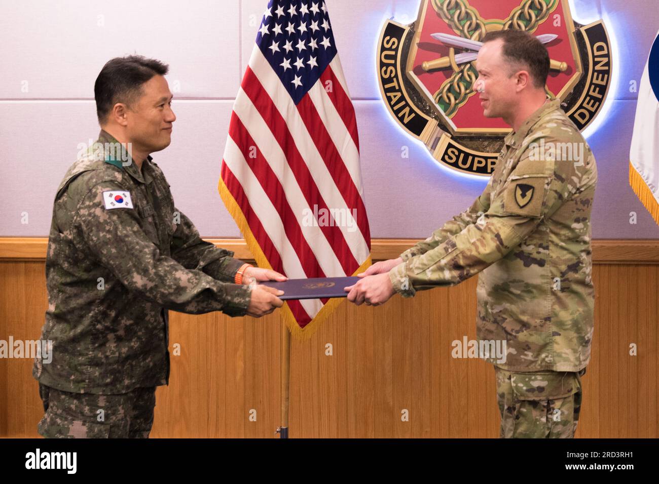 U.S. Army Col. Seth Graves, the U.S. Army Garrison Humphreys commander, right, eceives the Republic of Korea (ROK) Order of National Security Merit Samil Medal from ROK Army Support Group commander Col. Seok-mo Koo at Maude Hall on June 27, 2023. Graves is the seventh person to receive the award, which is signed by the president of the Republic of Korea, in recognition and appreciation of his outstanding and meritoriuous service to the ROK. Stock Photo