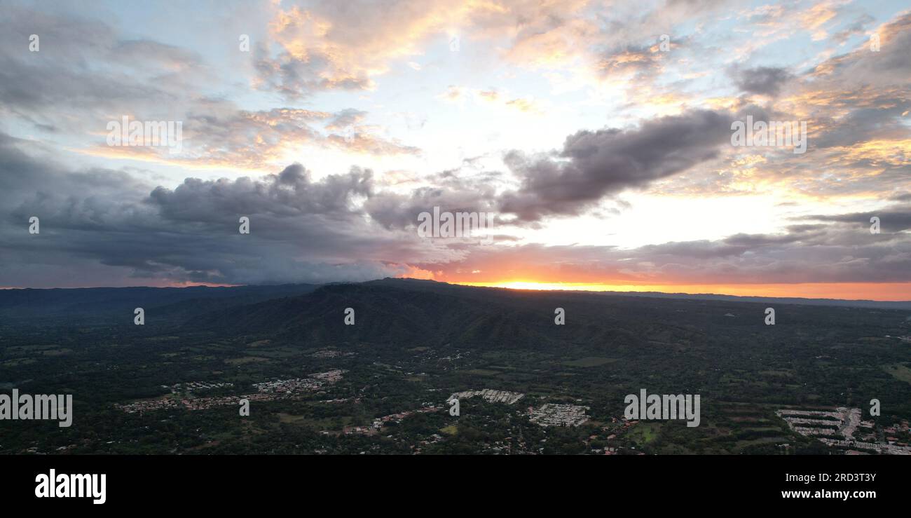 Beutiful sunset over green hills aerial drone view Stock Photo