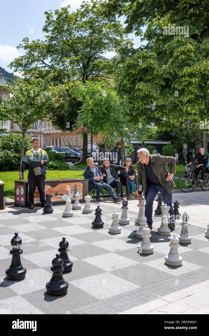 Children playing chess game on street with large size chess pieces and chess  board on street of Mile End in Le Plateau Mont Royal.Montreal.Quebec.Canada  Stock Photo - Alamy