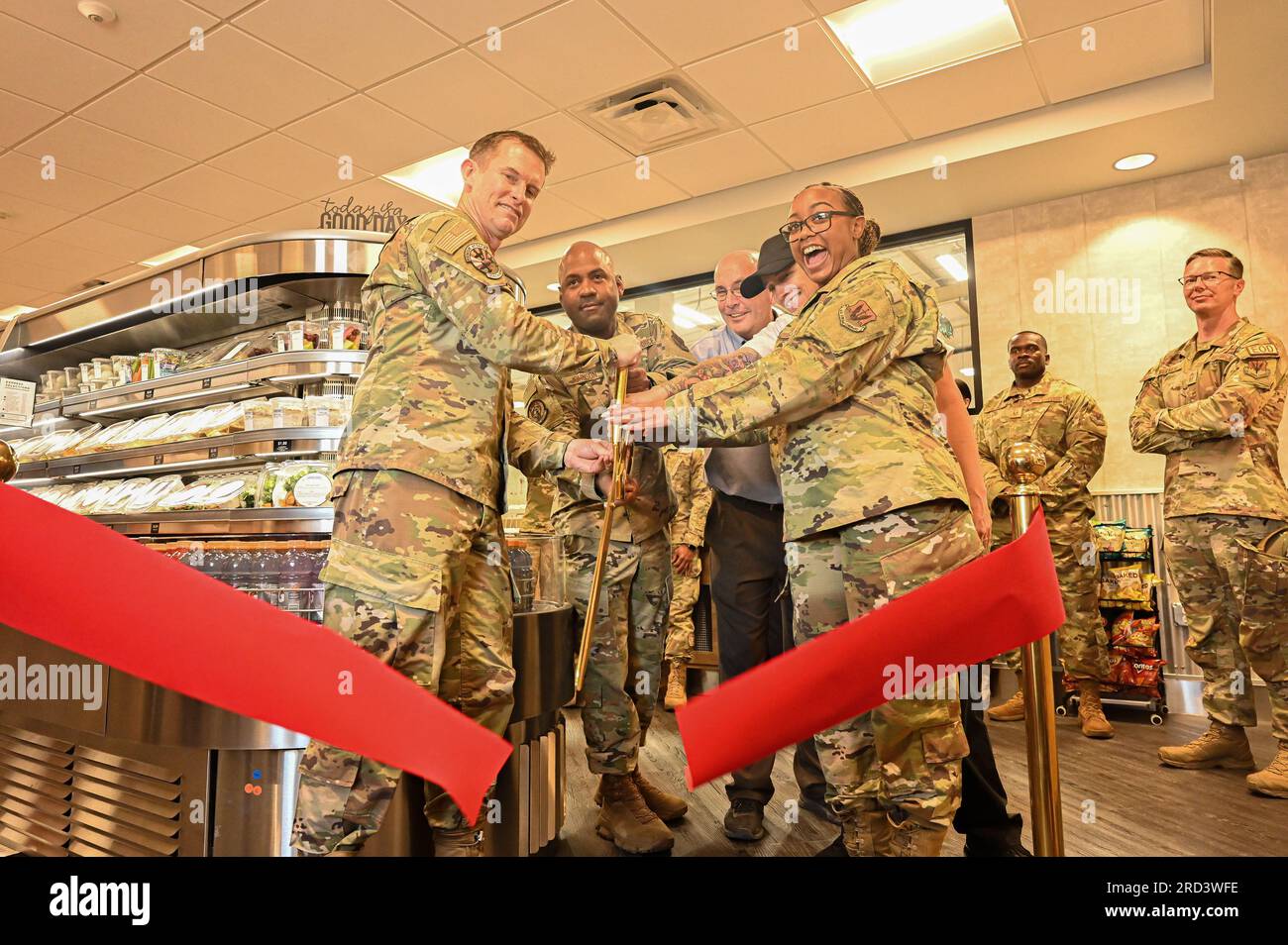 U.S. Air Force Col. Scott Mills, 355th Wing commander, and 355th Force Support Squadron personnel  cut a ribbon signifying the grand opening of the Rescue and Attack Kitchen at Davis-Monthan Air Force Base, Ariz., June 28, 2023. The kitchens that were opened across DMAFB were put in place to feed the over 12,000 Airmen assigned to the installation. Stock Photo
