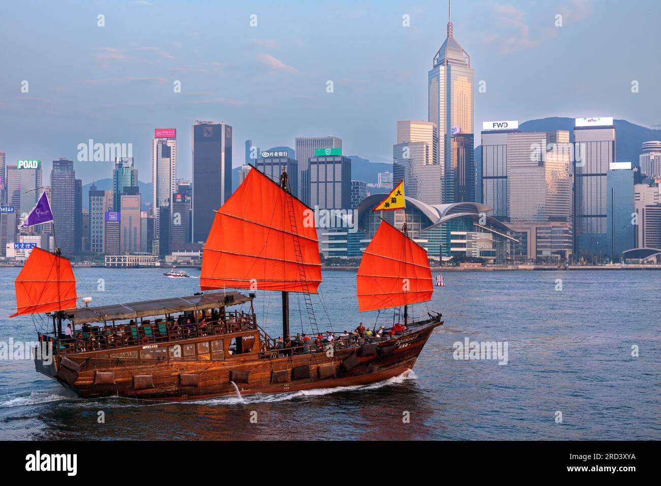 Tourist junk sailing in Victoria Harbour, Hong Kong, SAR, China Stock Photo