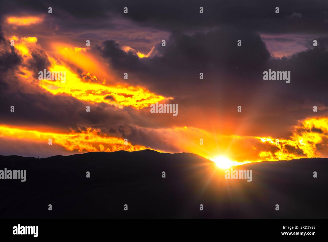 Dramatic colorful sunset on top of  Apennine mountain Stock Photo