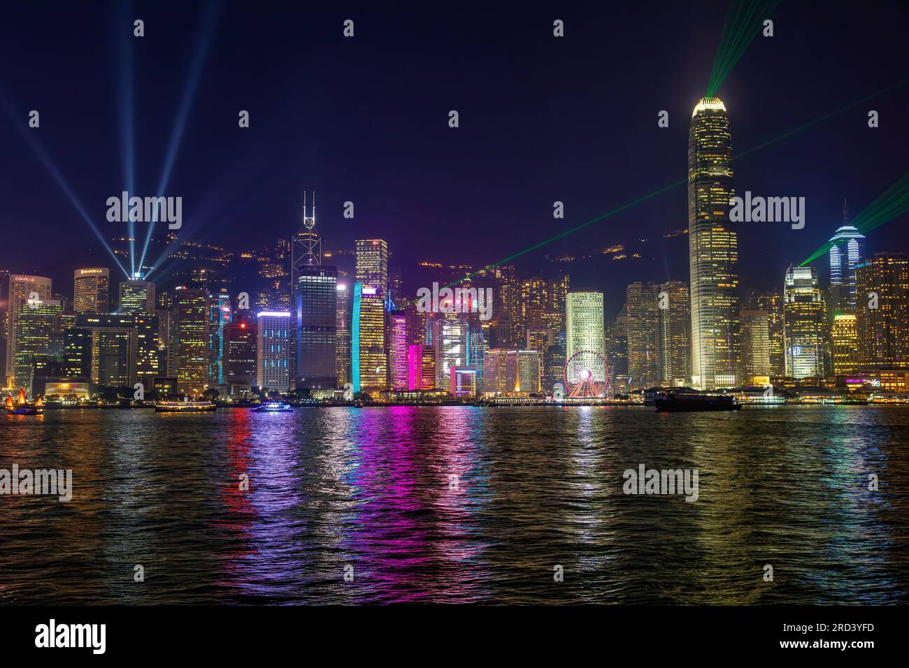 Hong Kong skyline at night with laser show, Victoria Harbour, SAR, China Stock Photo