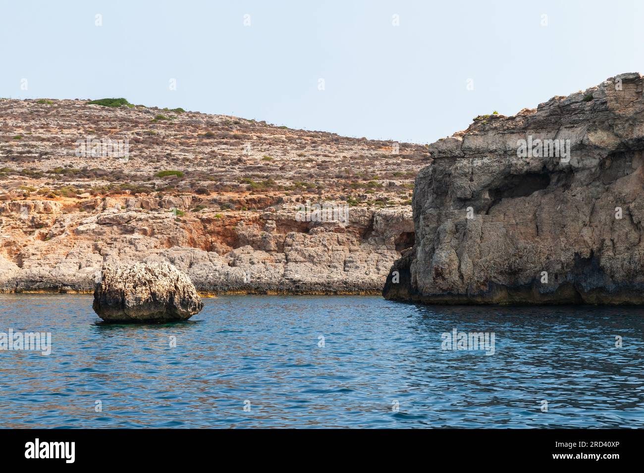 Landscape with rocky coasts of Comino island on a sunny day, Malta Stock Photo