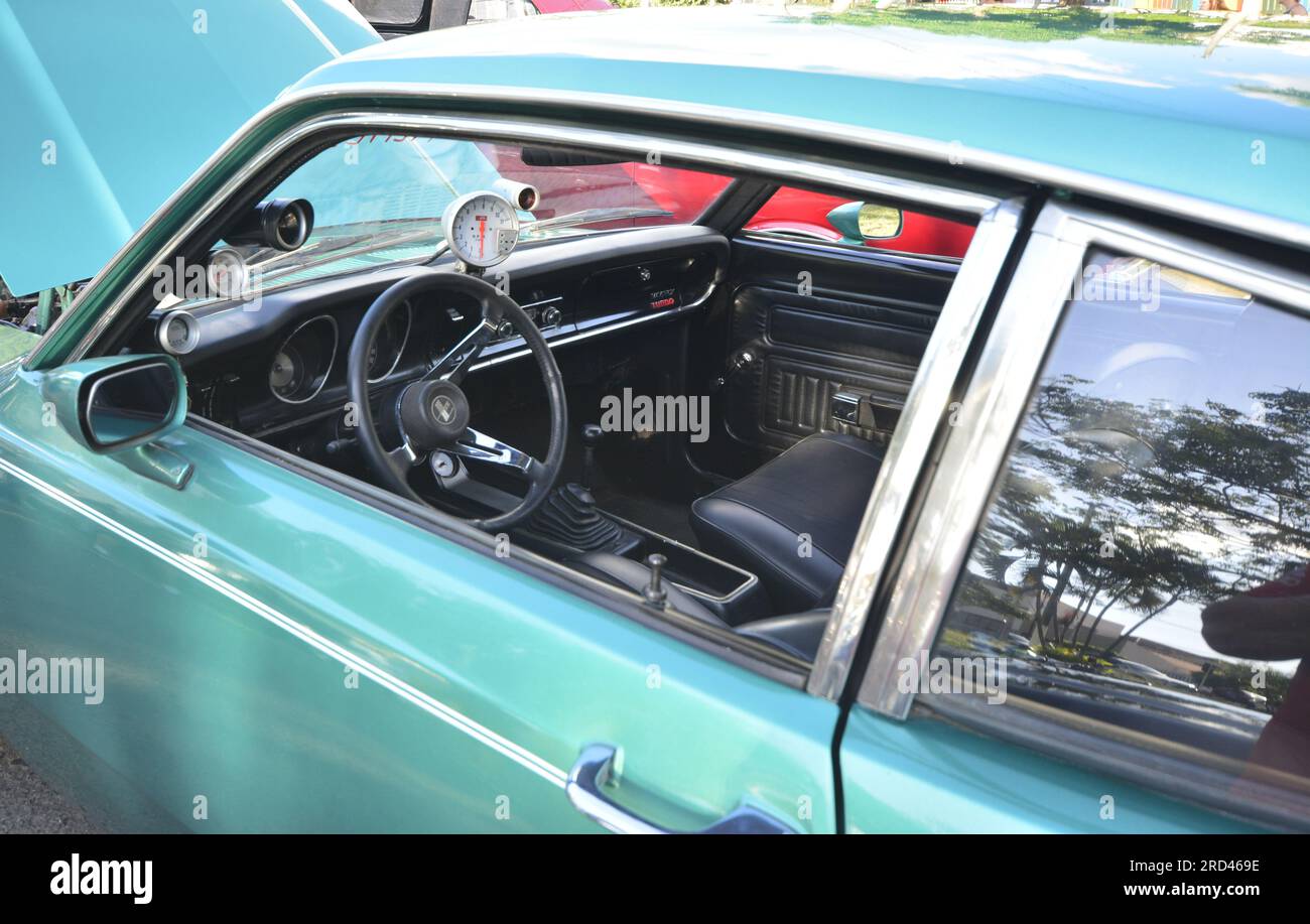 Vintage automobile on display at vintage car fair with open engine. Wide angle view. internal detail Stock Photo