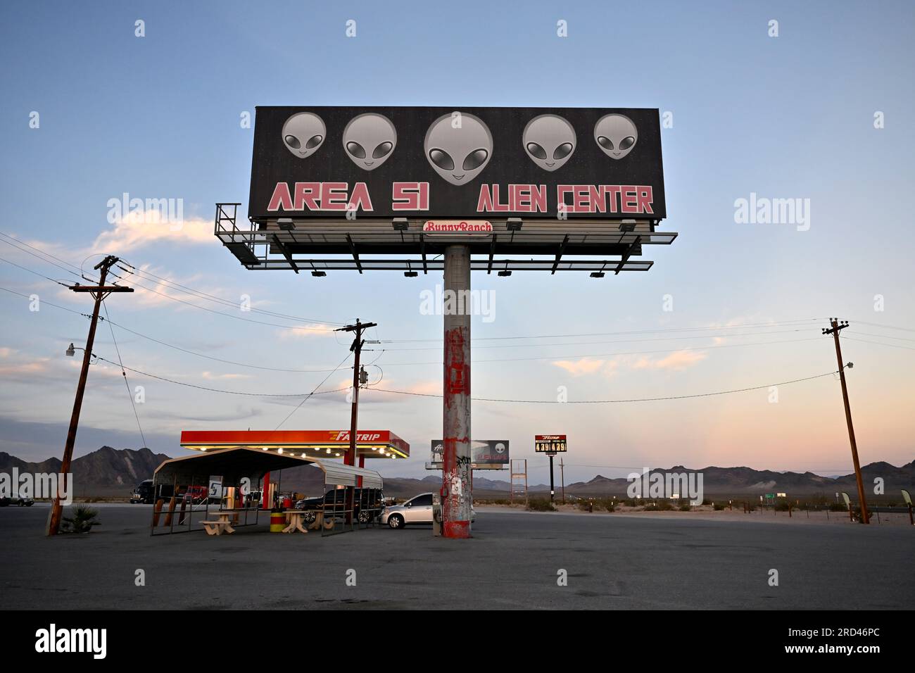 Amargosa Valley, Nevada, USA. 16th July, 2023. A billboard for the Area 51 Alien Center is seen at sunset on July 16, 2023, in Amagrosa Valley, Nevada. The roadside extraterrestrial-themed souvenir shop sits along U.S. Highway 95 about 90 miles north of Las Vegas and borders the southwest corner of the Nevada National Security Site, formally known as the Nevada Test Site, where the secret base Area 51 is located. (Credit Image: © David Becker/ZUMA Press Wire) EDITORIAL USAGE ONLY! Not for Commercial USAGE! Stock Photo