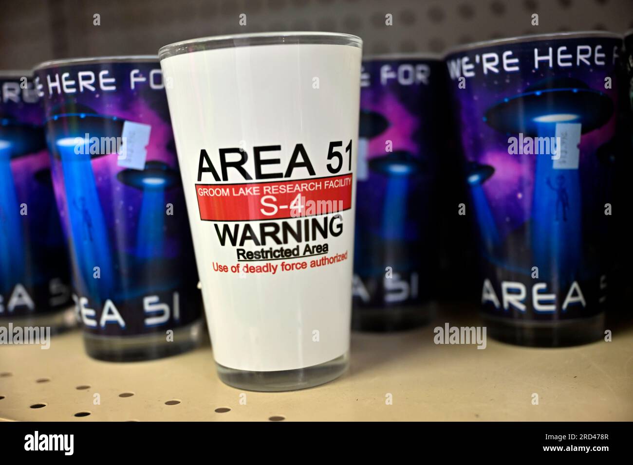 Amargosa Valley, Nevada, USA. 16th July, 2023. Merchandise including Area 51-themed glassware is displayed for sale inside the Area 51 Alien Center on July 16, 2023, in Amagrosa Valley, Nevada. The roadside extraterrestrial-themed souvenir shop sits along U.S. Highway 95 about 90 miles north of Las Vegas and borders the southwest corner of the Nevada National Security Site, formally known as the Nevada Test Site, where the secret base Area 51 is located. (Credit Image: © David Becker/ZUMA Press Wire) EDITORIAL USAGE ONLY! Not for Commercial USAGE! Stock Photo