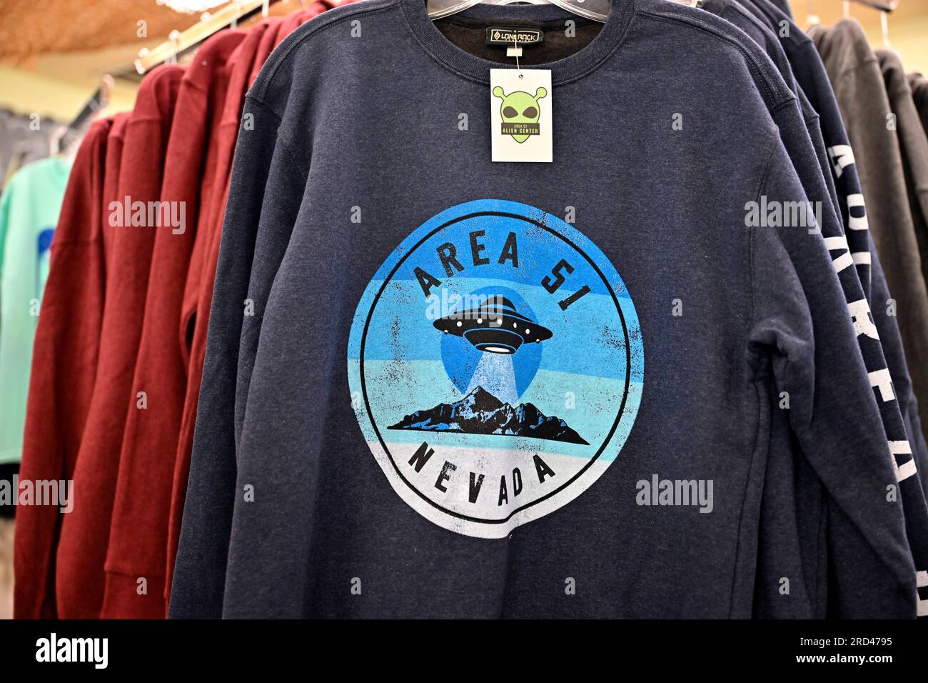 Amargosa Valley, Nevada, USA. 16th July, 2023. Merchandise including Area 51-themed shirts are displayed for sale inside the Area 51 Alien Center on July 16, 2023, in Amagrosa Valley, Nevada. The roadside extraterrestrial-themed souvenir shop sits along U.S. Highway 95 about 90 miles north of Las Vegas and borders the southwest corner of the Nevada National Security Site, formally known as the Nevada Test Site, where the secret base Area 51 is located. (Credit Image: © David Becker/ZUMA Press Wire) EDITORIAL USAGE ONLY! Not for Commercial USAGE! Stock Photo