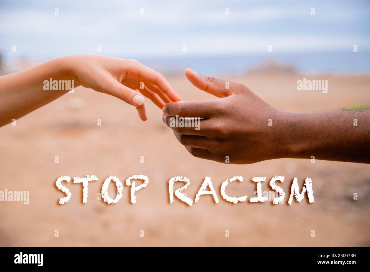 White hand of a woman and black of a man, concept of diversity and stop racism Stock Photo