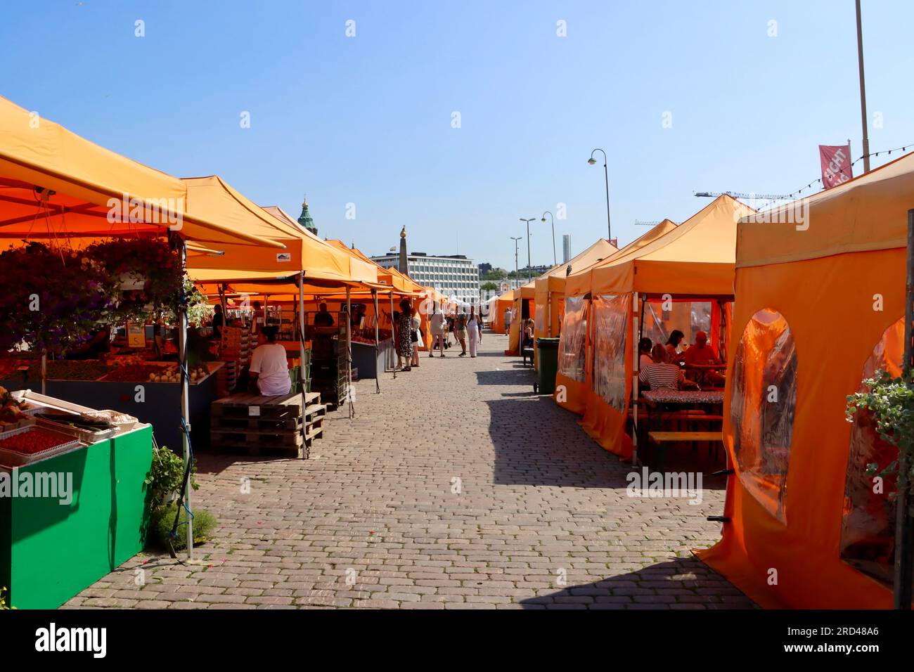 Yellow tented vendor booths at Market Square in the harbor in the center of Helsinki, Finland Stock Photo