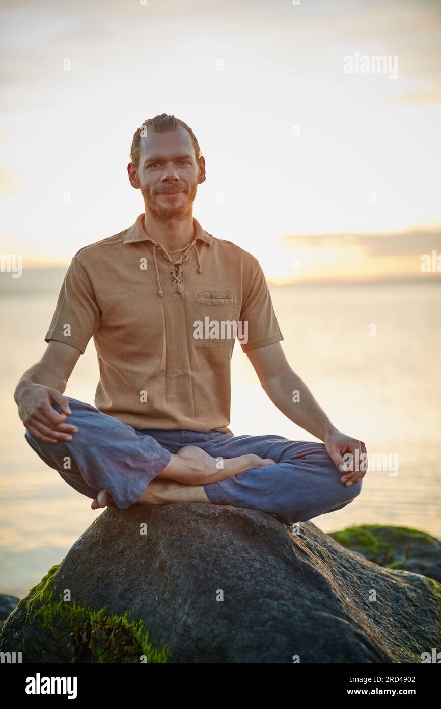 Happiness is right here, right now. Shot of a man sitting in the lotus ...
