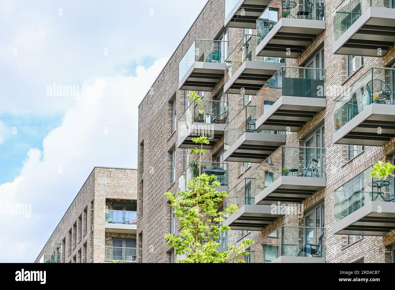 Modern apartment building with balconies and blue sky at Castle Street ...