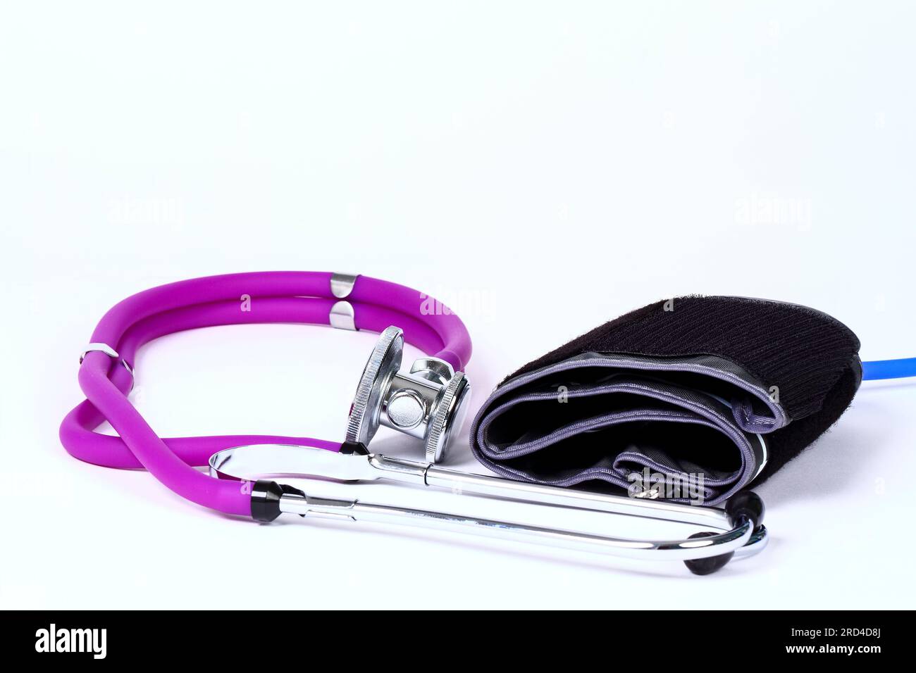Stethoscope next to a blood pressure cuff Stock Photo