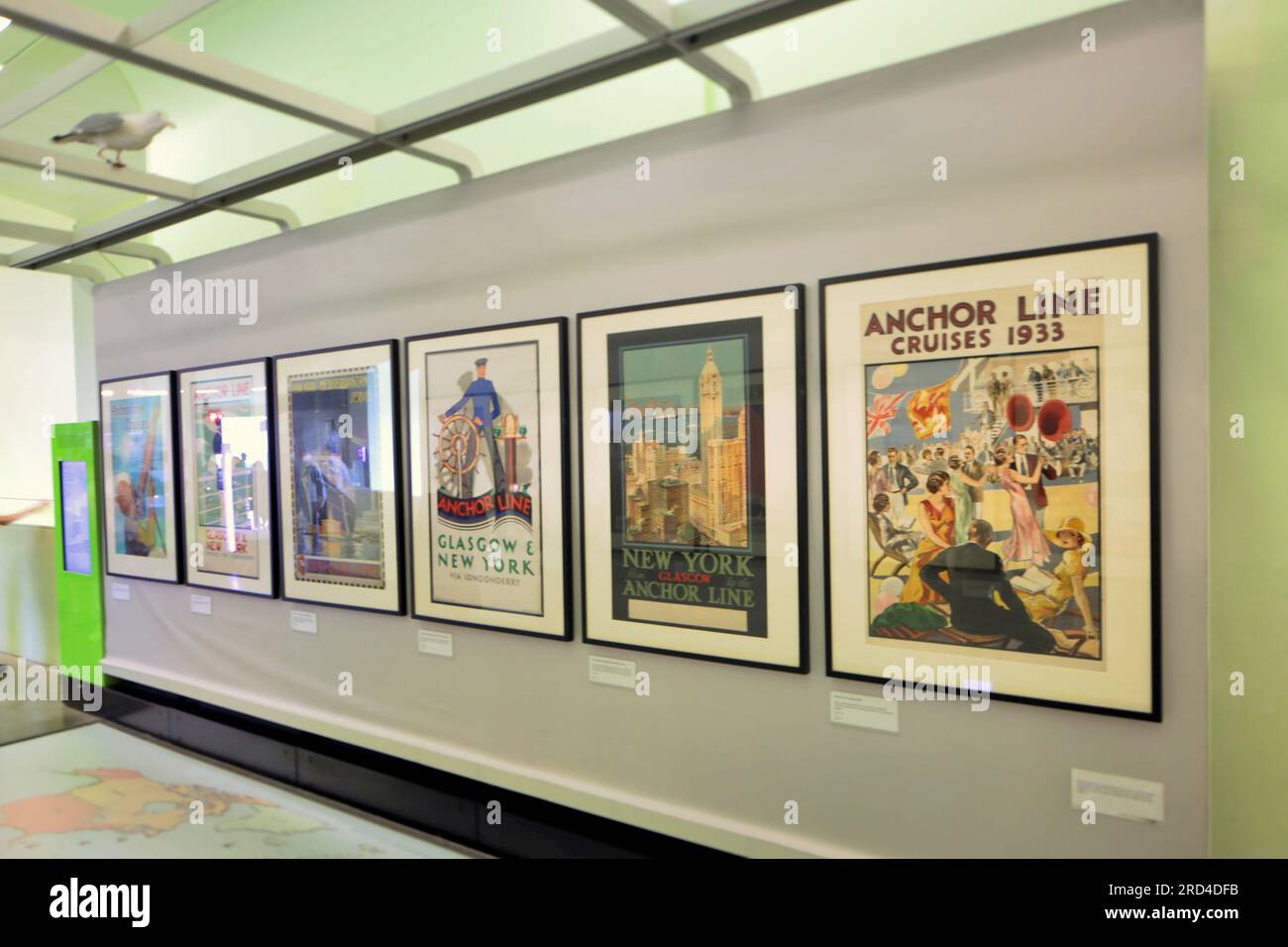 Vintage liner travel posters  Tourists and schoolchildren groups on holiday from school crowded Zaha Hadid riverside museum of transport Stock Photo