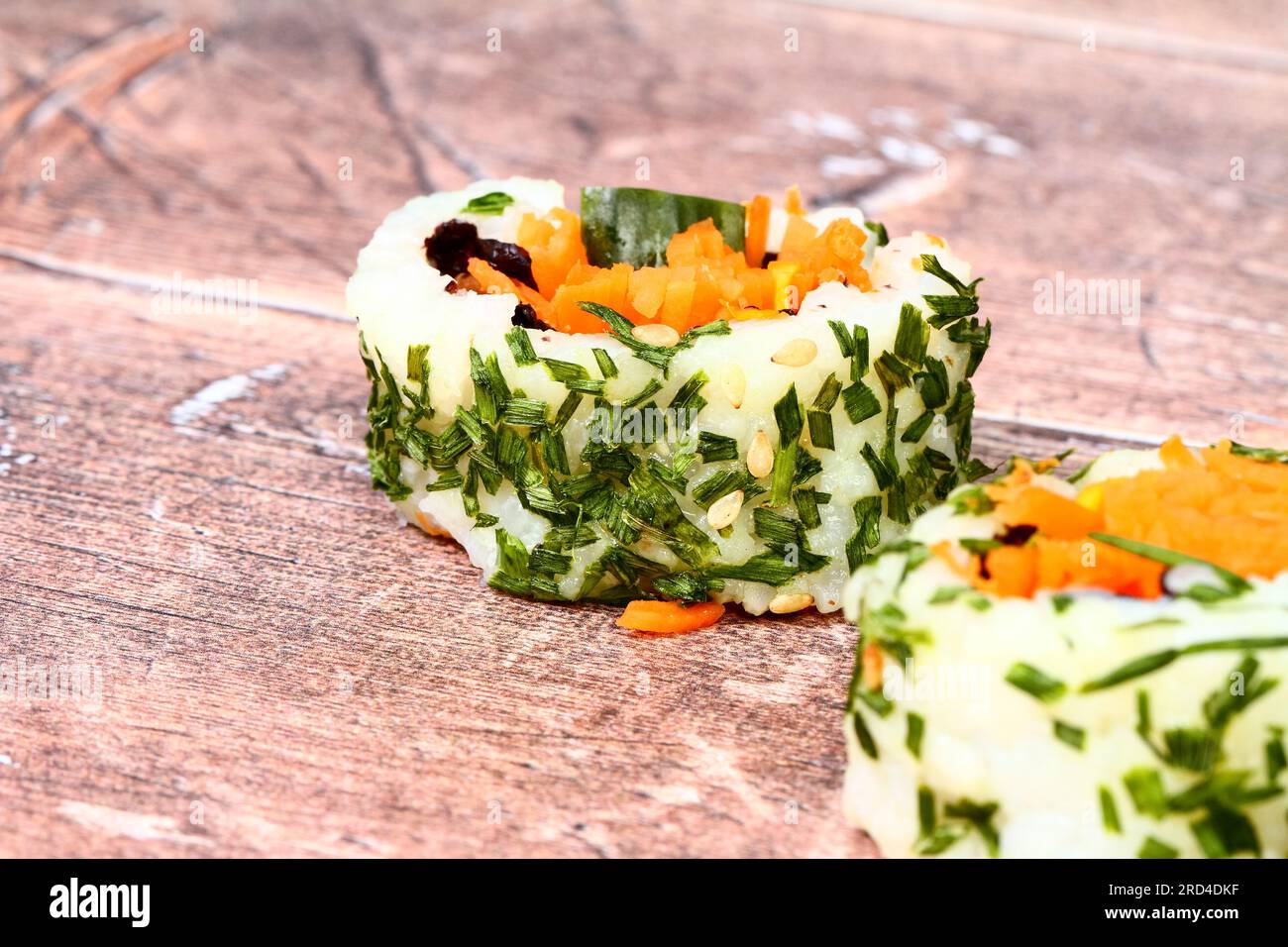 Vegan Sushi rolls on a wood table Stock Photo