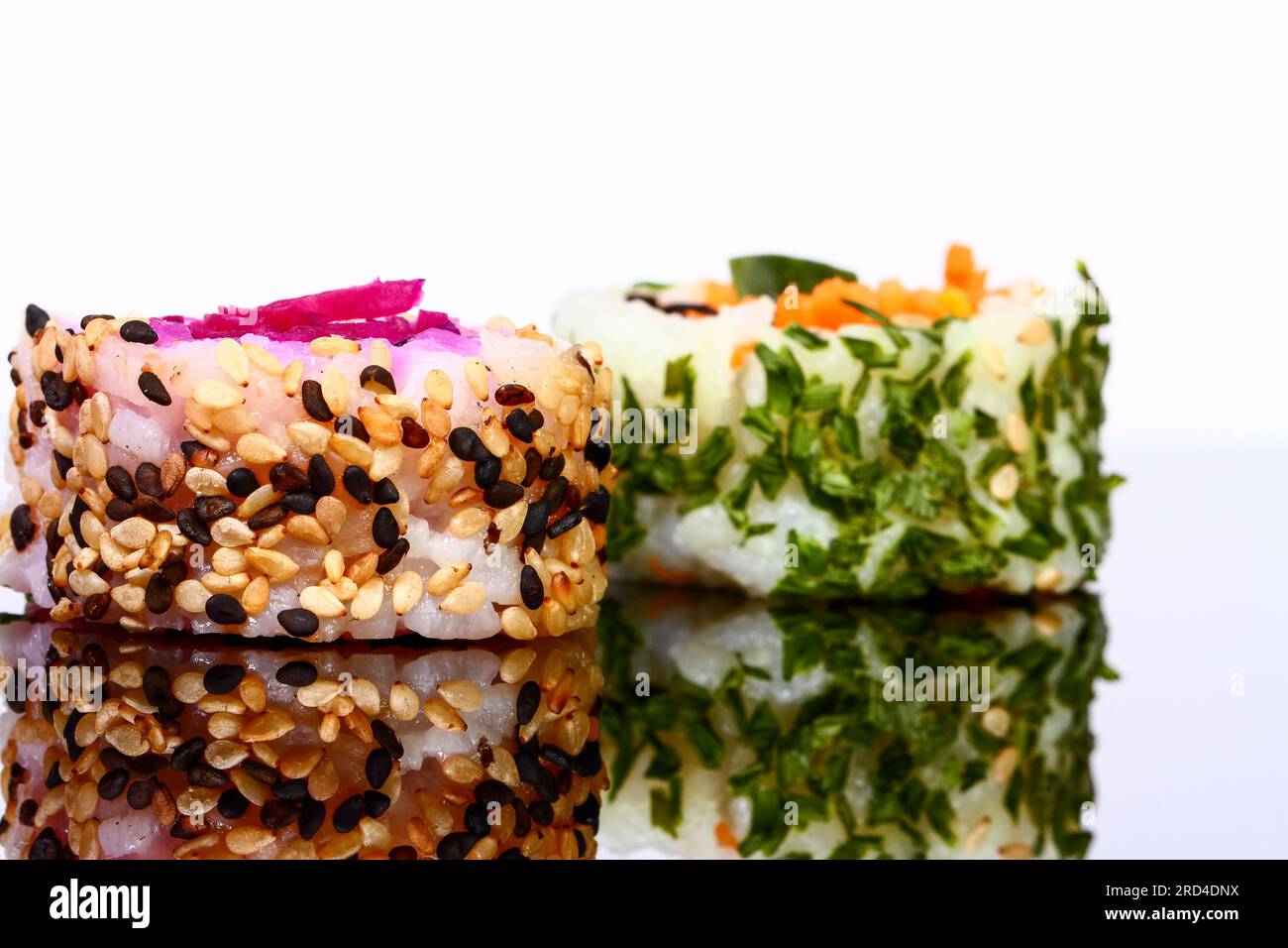 Vegan sushi roll isolated on black glass Stock Photo