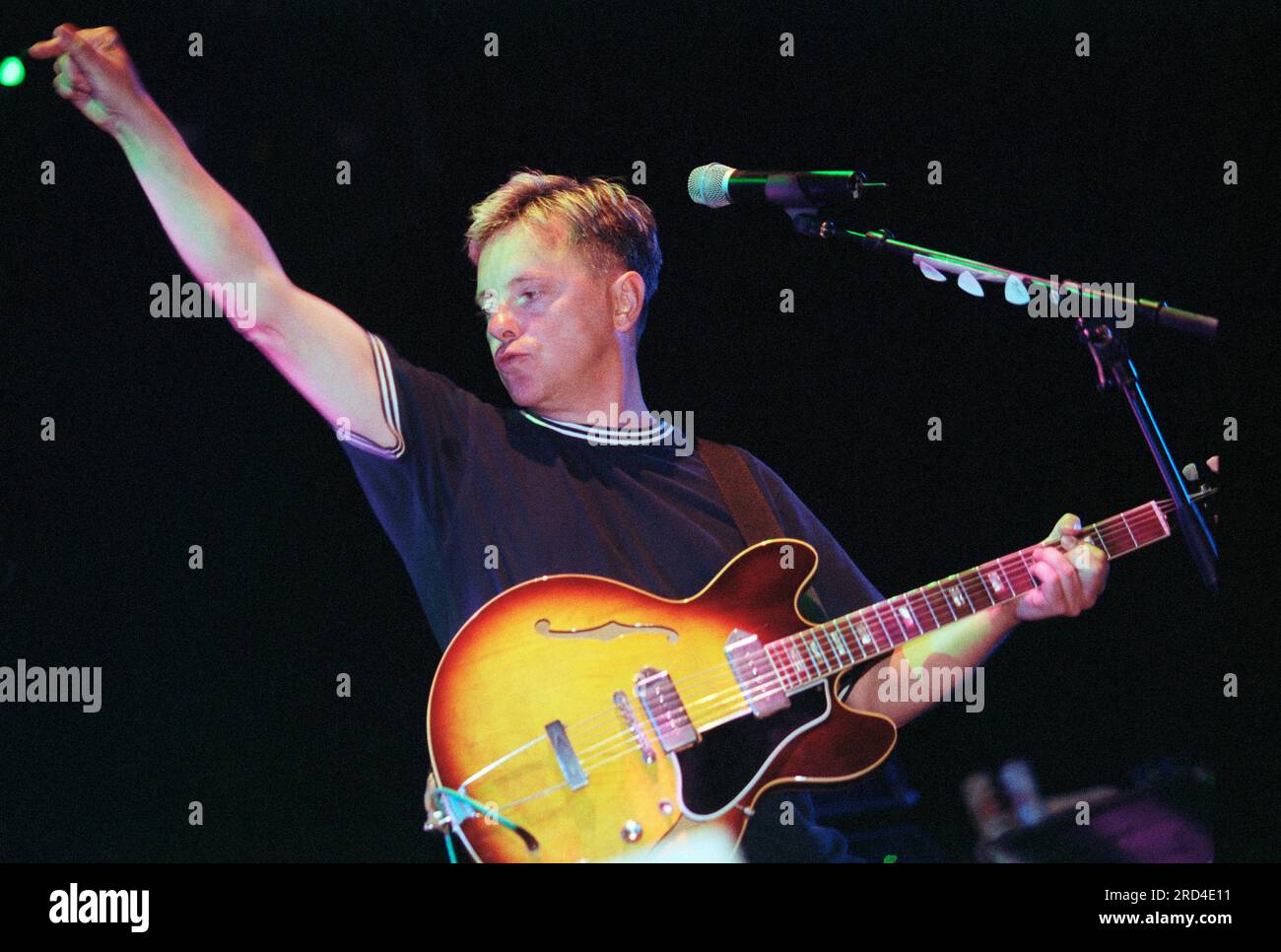 New Order, English rock band formed in 1980 by vocalist and guitarist Bernard Sumner with bassist Peter Hook, playing live at Reading Festival in 1998 Stock Photo