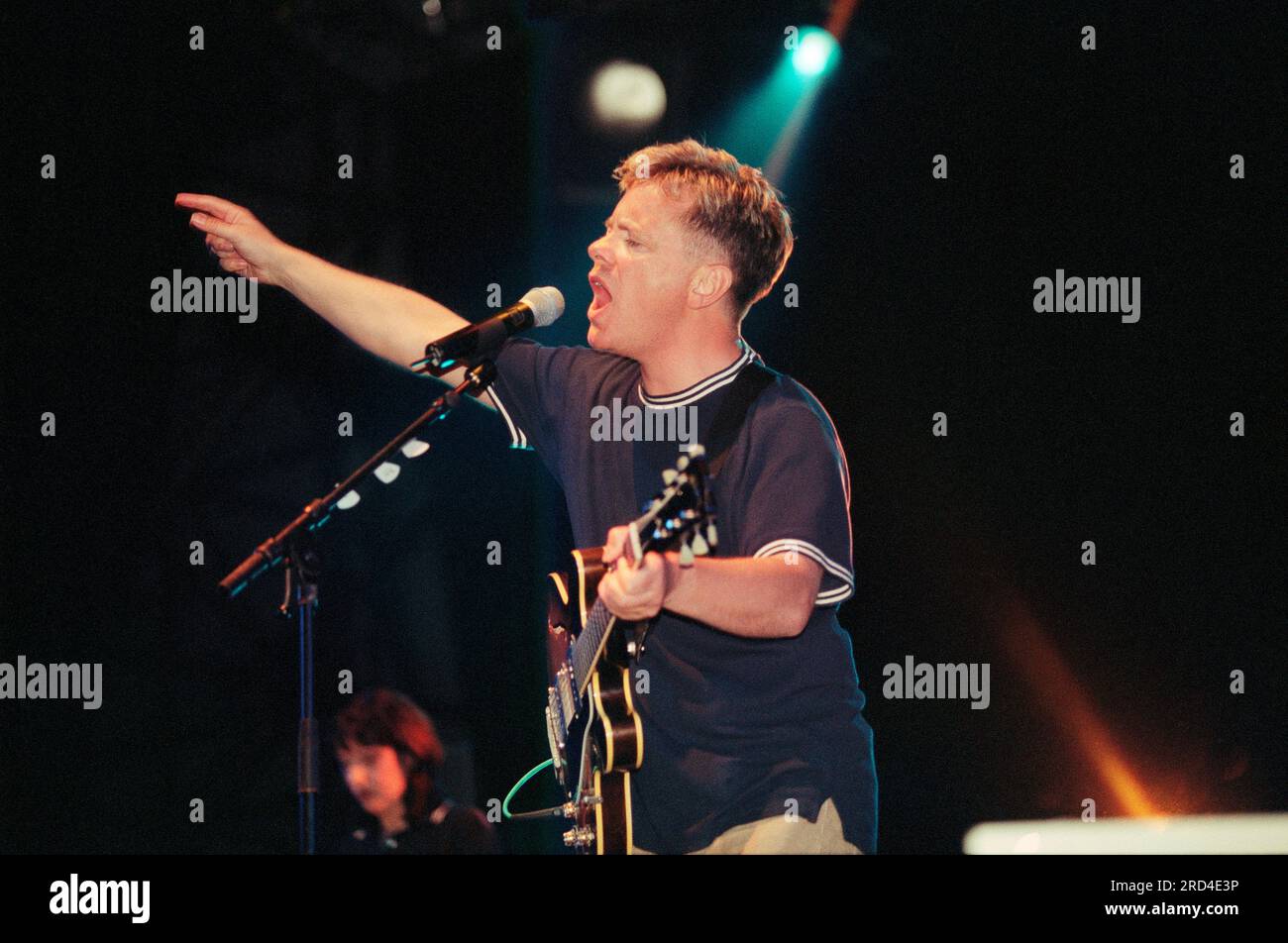 New Order, English rock band formed in 1980 by vocalist and guitarist Bernard Sumner with bassist Peter Hook, playing live at Reading Festival in 1998 Stock Photo