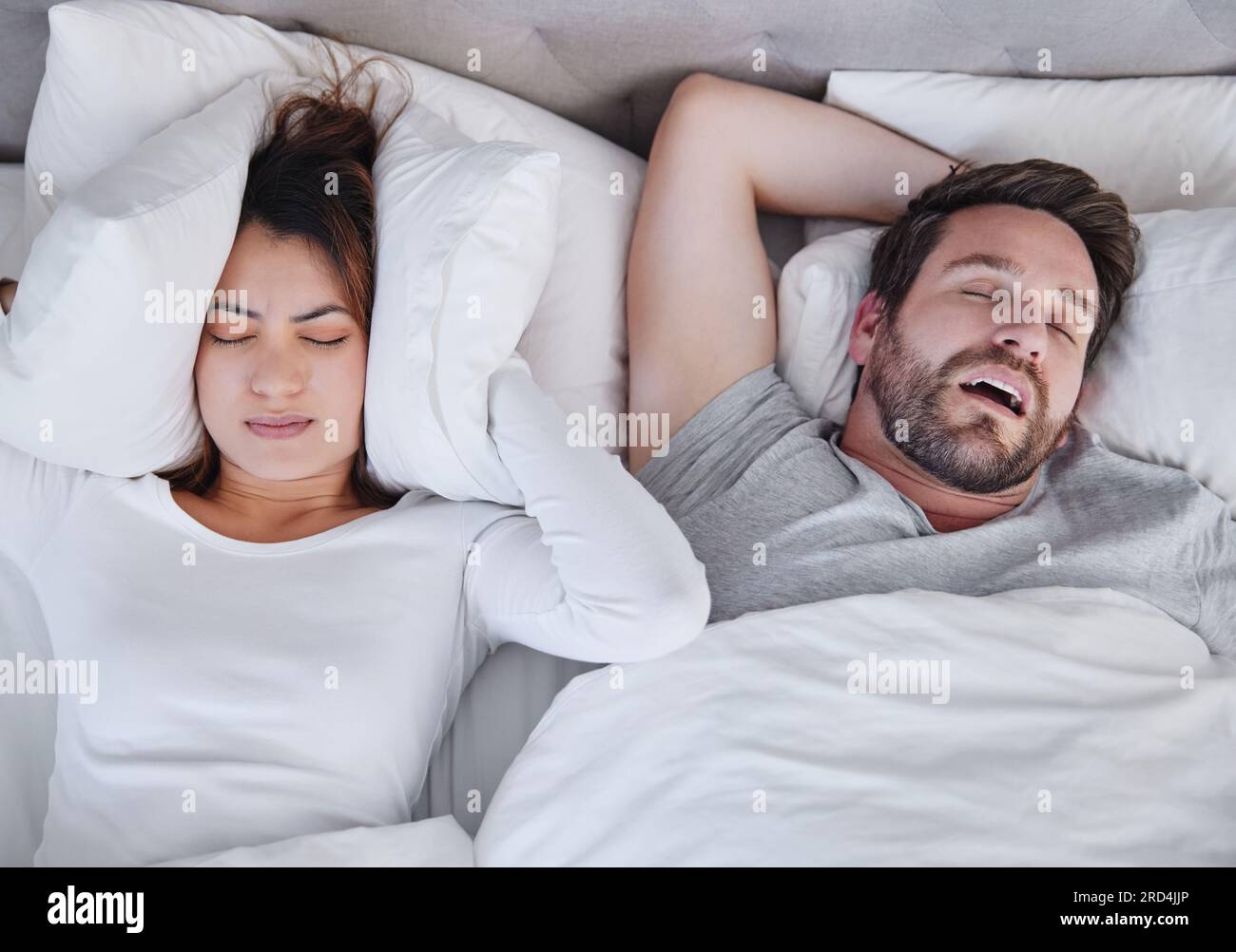 Snoring, stress and above angry woman with sleeping man in bed, unhappy
