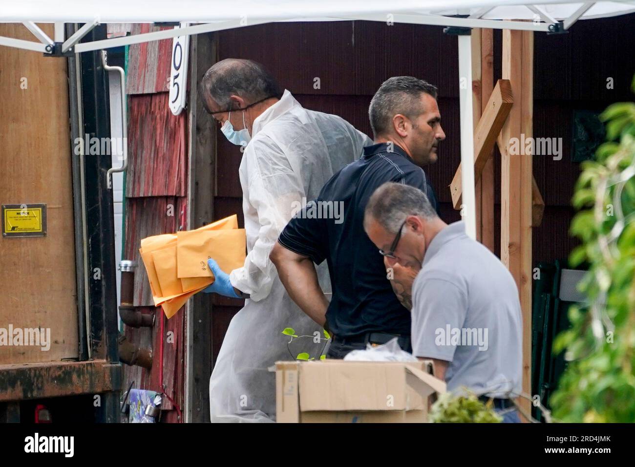 Authorities remove evidence as they search the home of suspect Rex  Heuermann, Tuesday, July 18, 2023, in Massapequa Park, N.Y. Police carted  more boxes of potential evidence Tuesday out of the Long