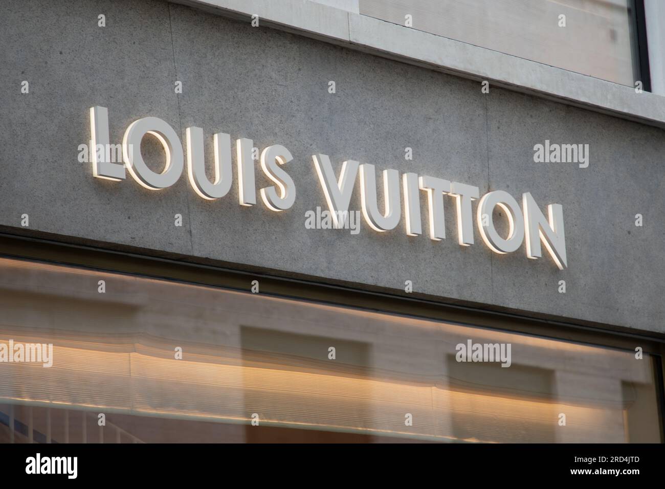 Milan , Italy  - 07 10 2023 : louis vuitton logo and sign text facade entrance chain store brand shop in street view Stock Photo