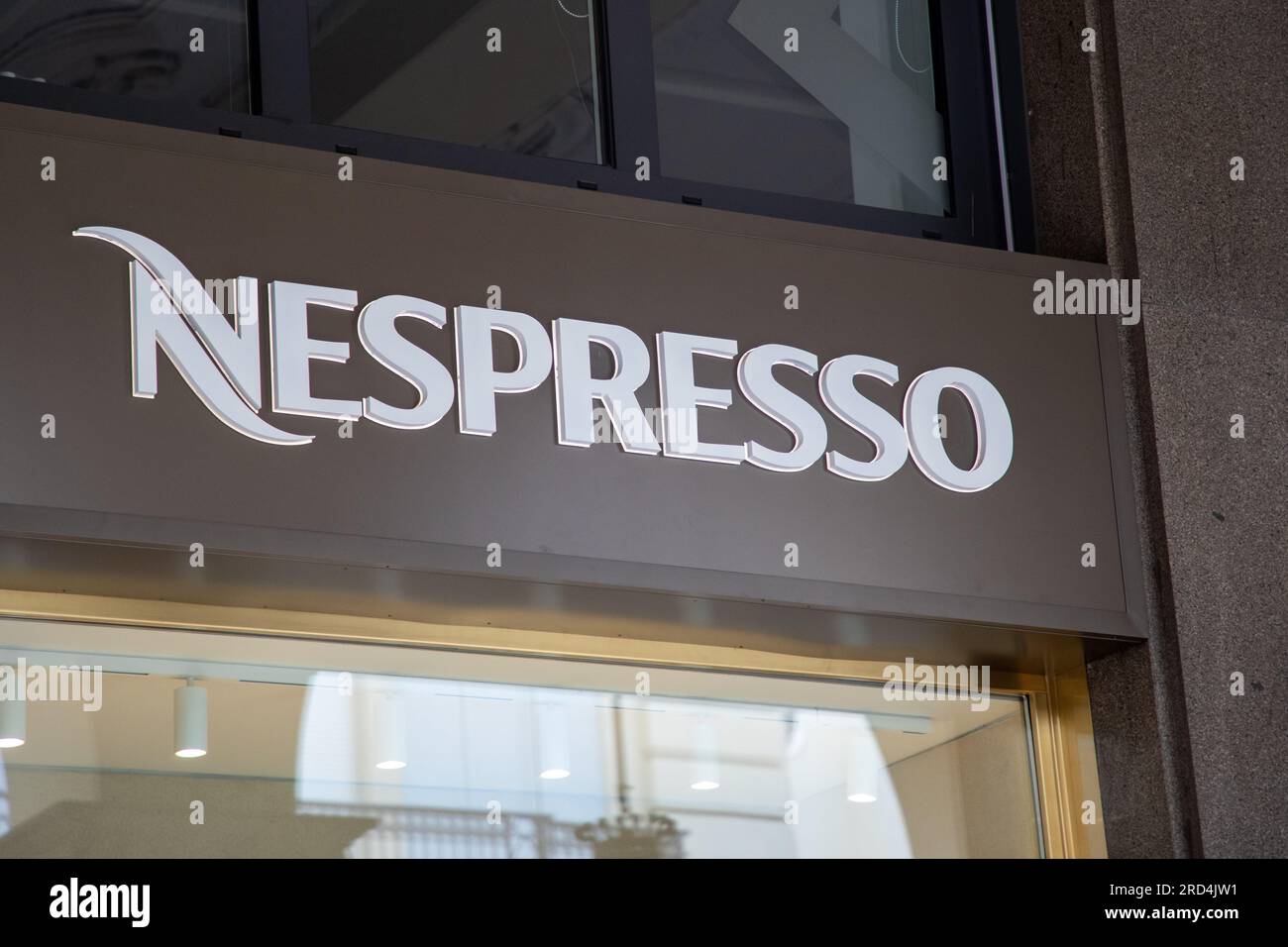Milan , Italy  - 07 10 2023 : nespresso logo brand and text sign on wall coffee shop advertising facade chain facade store Stock Photo