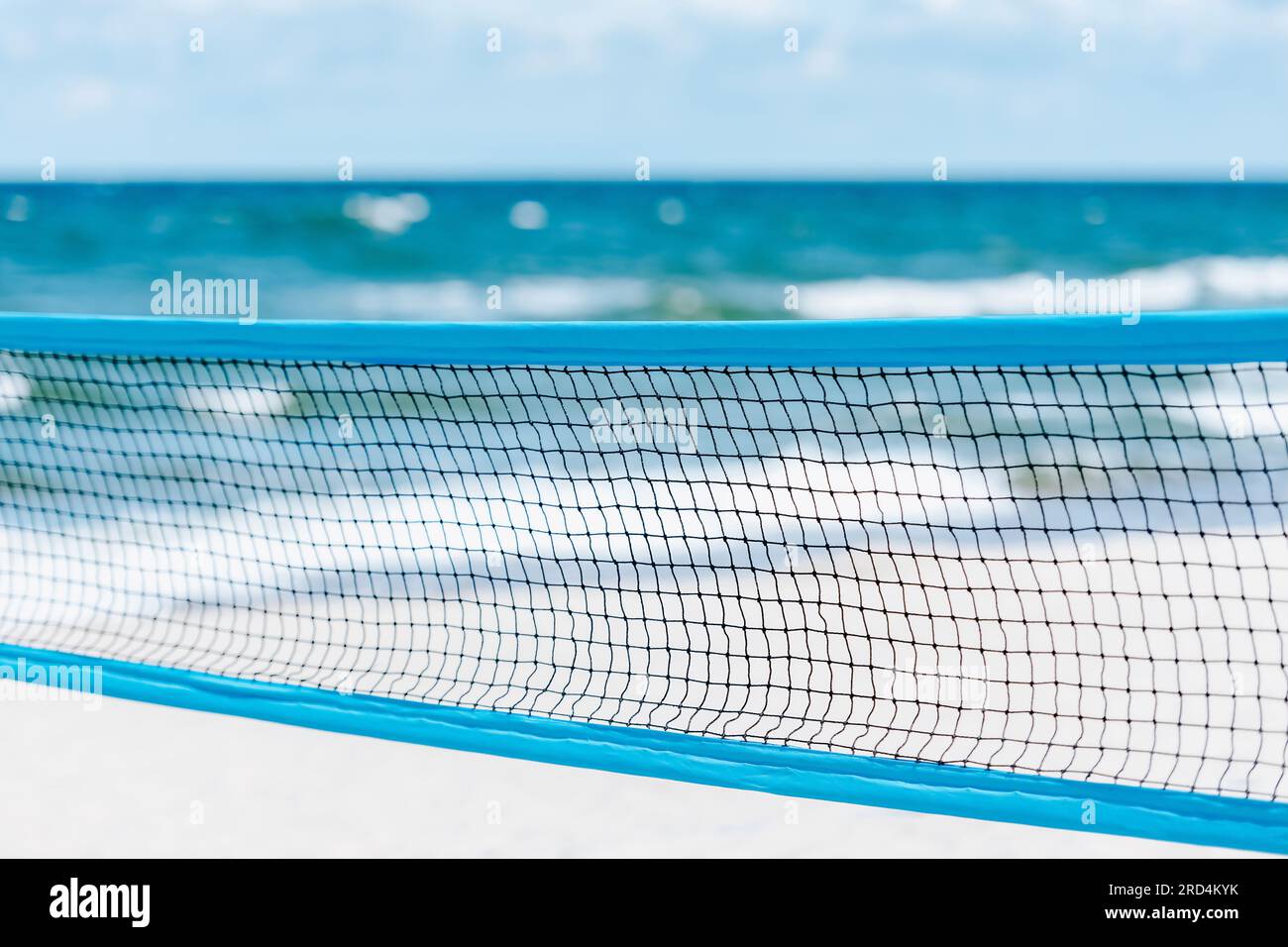Beach volleyball and beach tennis net on the background of sand. Horizontal sport theme poster