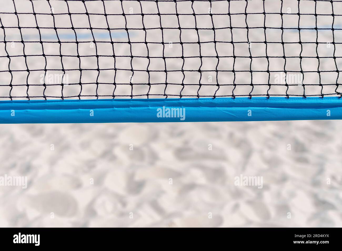 Beach volleyball and beach tennis net on the background of sand