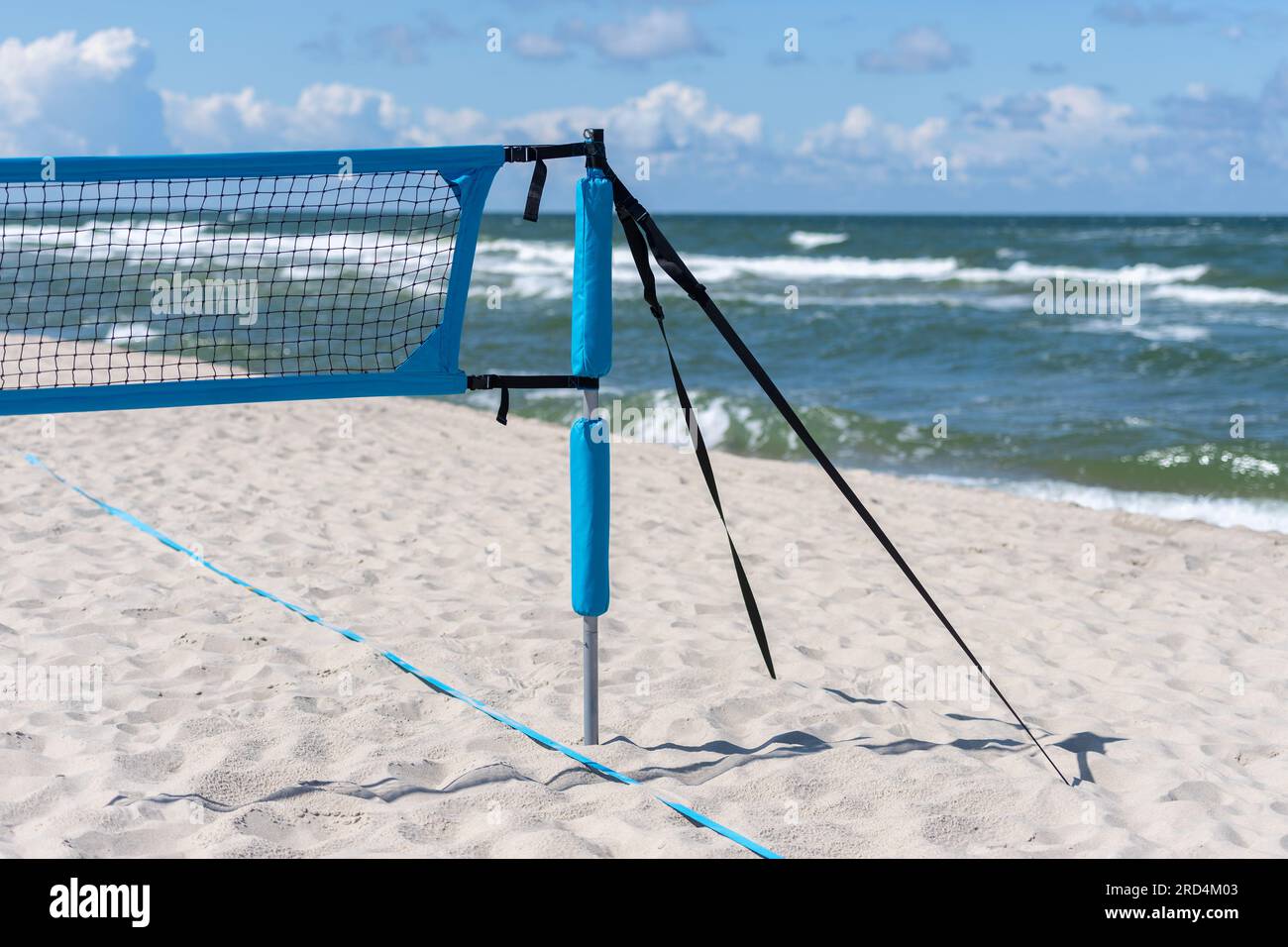Beach volleyball and beach tennis net on the background of sand. Horizontal sport theme poster