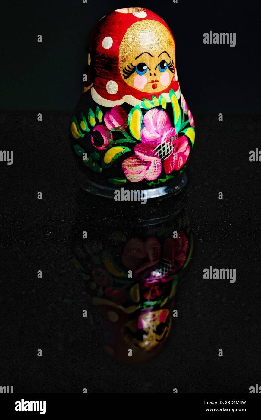 russian nesting dolls with reflection on a black background Stock Photo