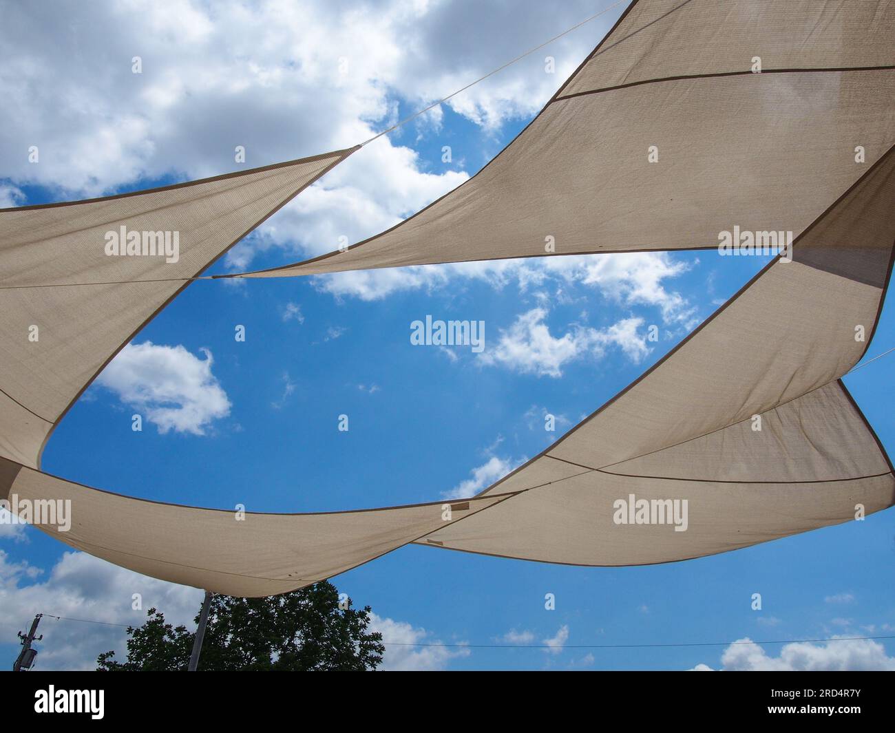 Sun shade sails against blue sky, USA, June 2023, © Katharine Andriotis