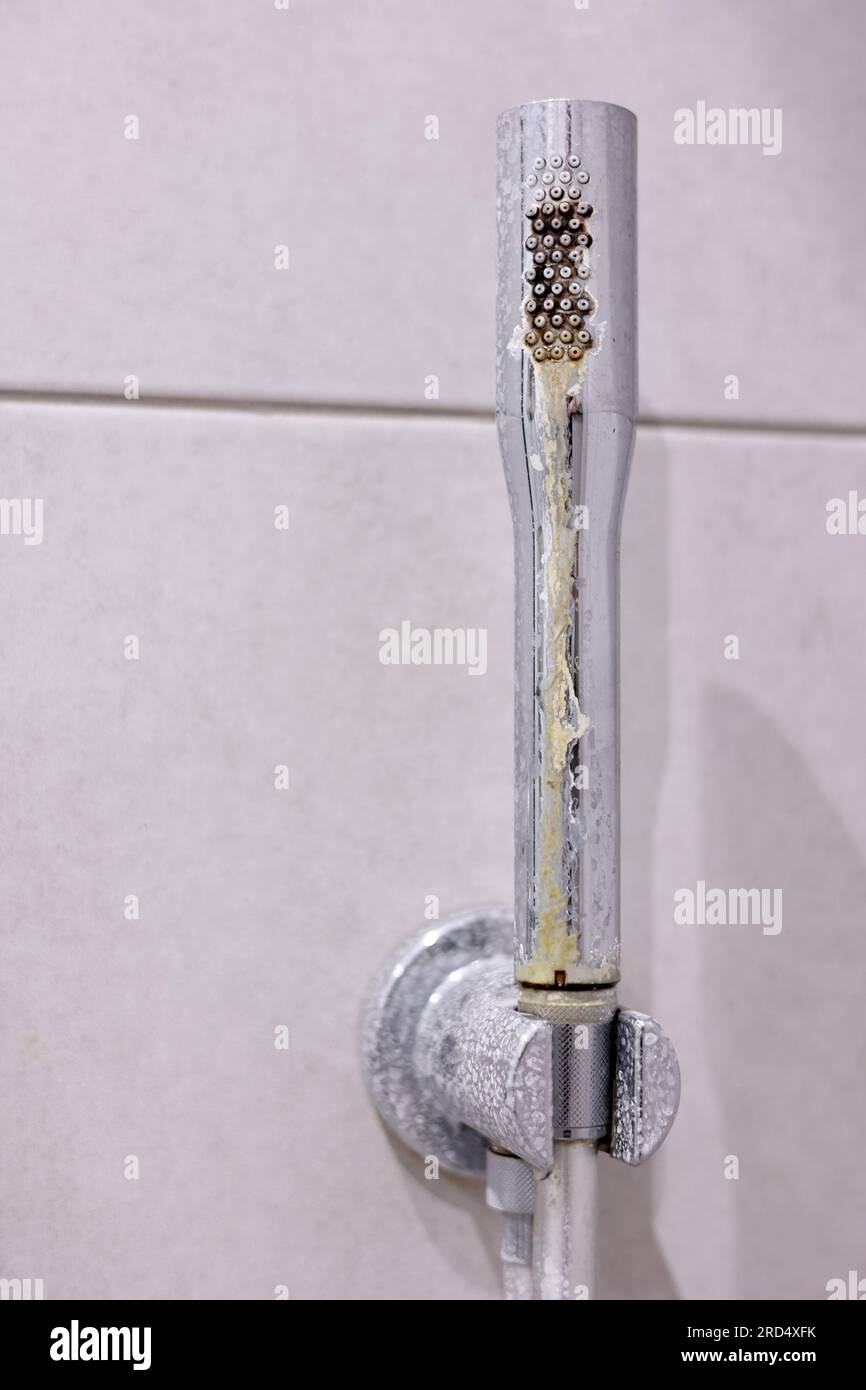 Dirty calcified shower chrome mixer tap, faucet with limescale on it