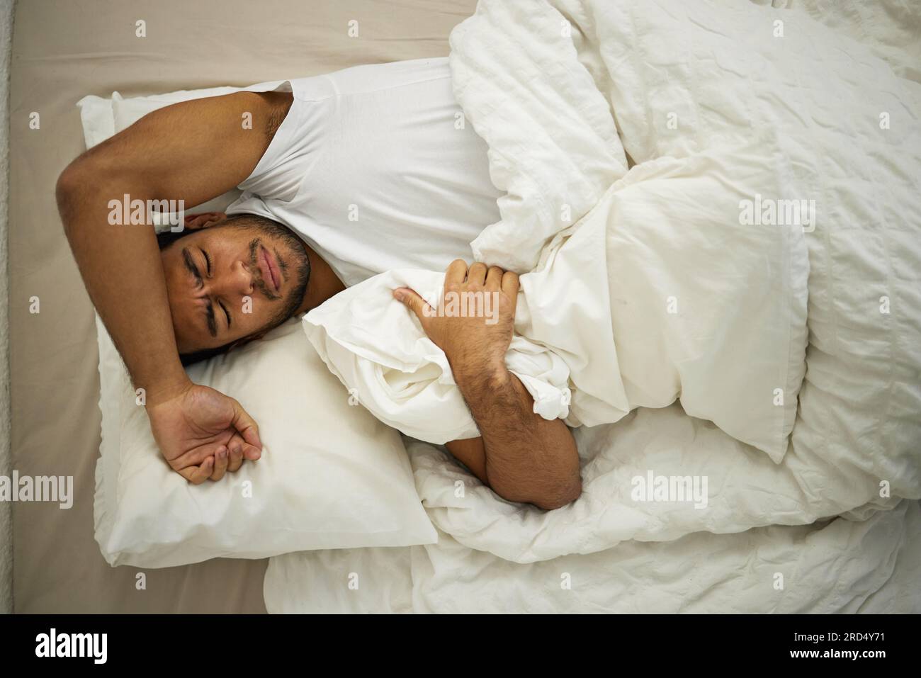 Sleeping problem headache and man rest in bed with pillow at home with insomnia and fatigue. Morning male person and house feeling frustrated from Stock Photo Alamy