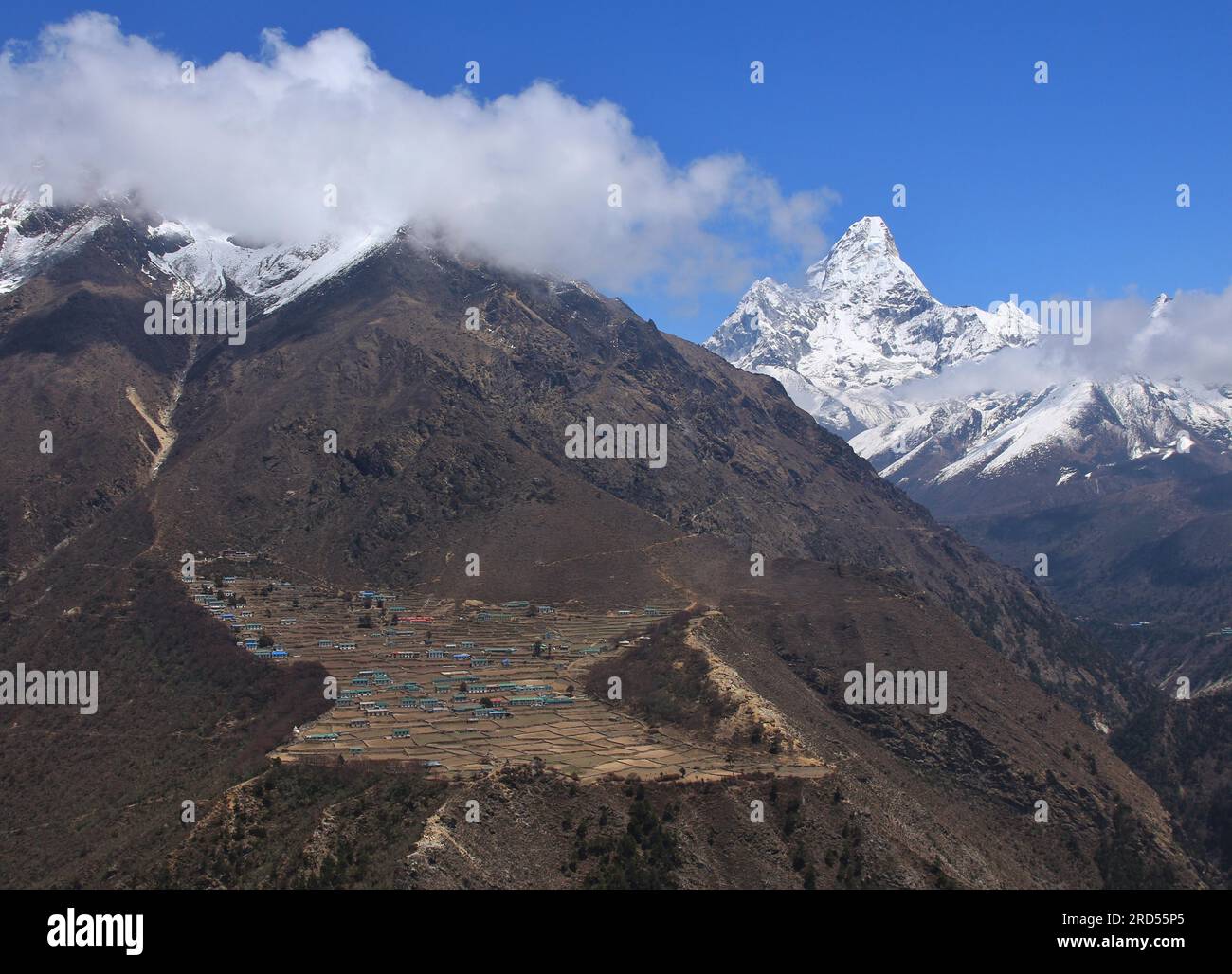 Sherpa village Phortse. Peak of Ama Dablam. Spring scene on the way to Everest base camp, Nepal Stock Photo