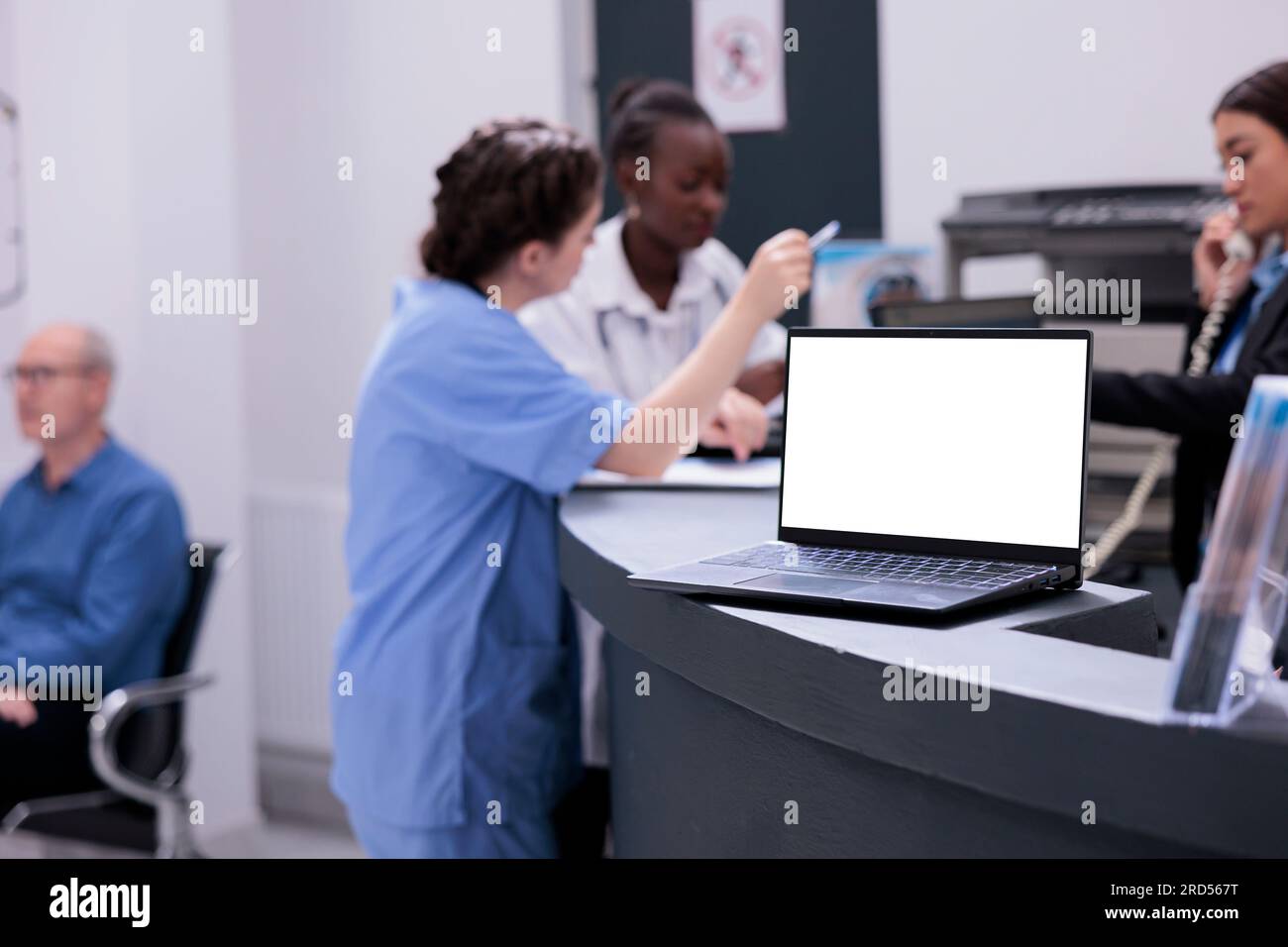 Medical staff working at patient treatment discussing disease symptoms ...