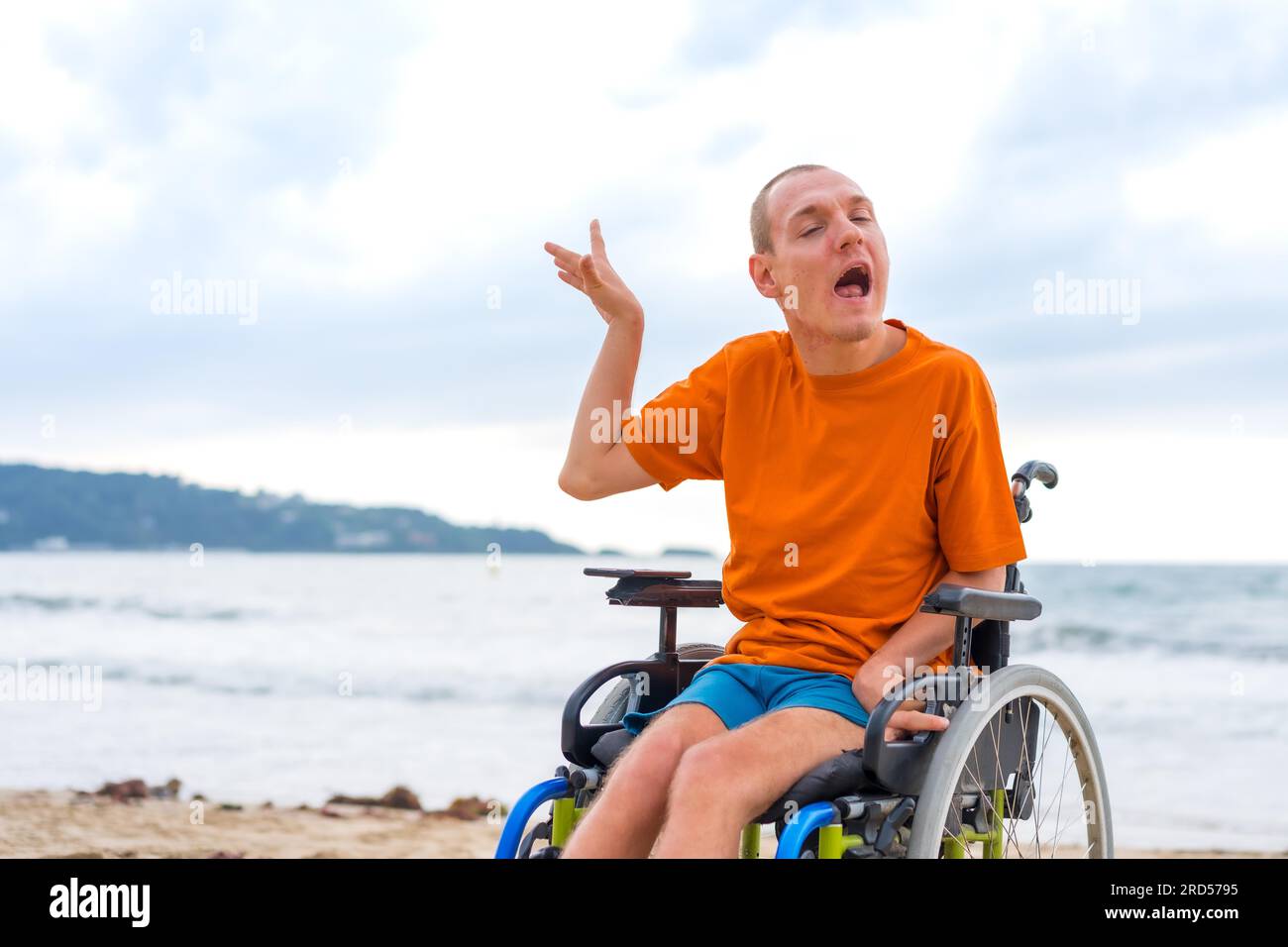A disabled person in a wheelchair on the beach in summer Stock Photo ...