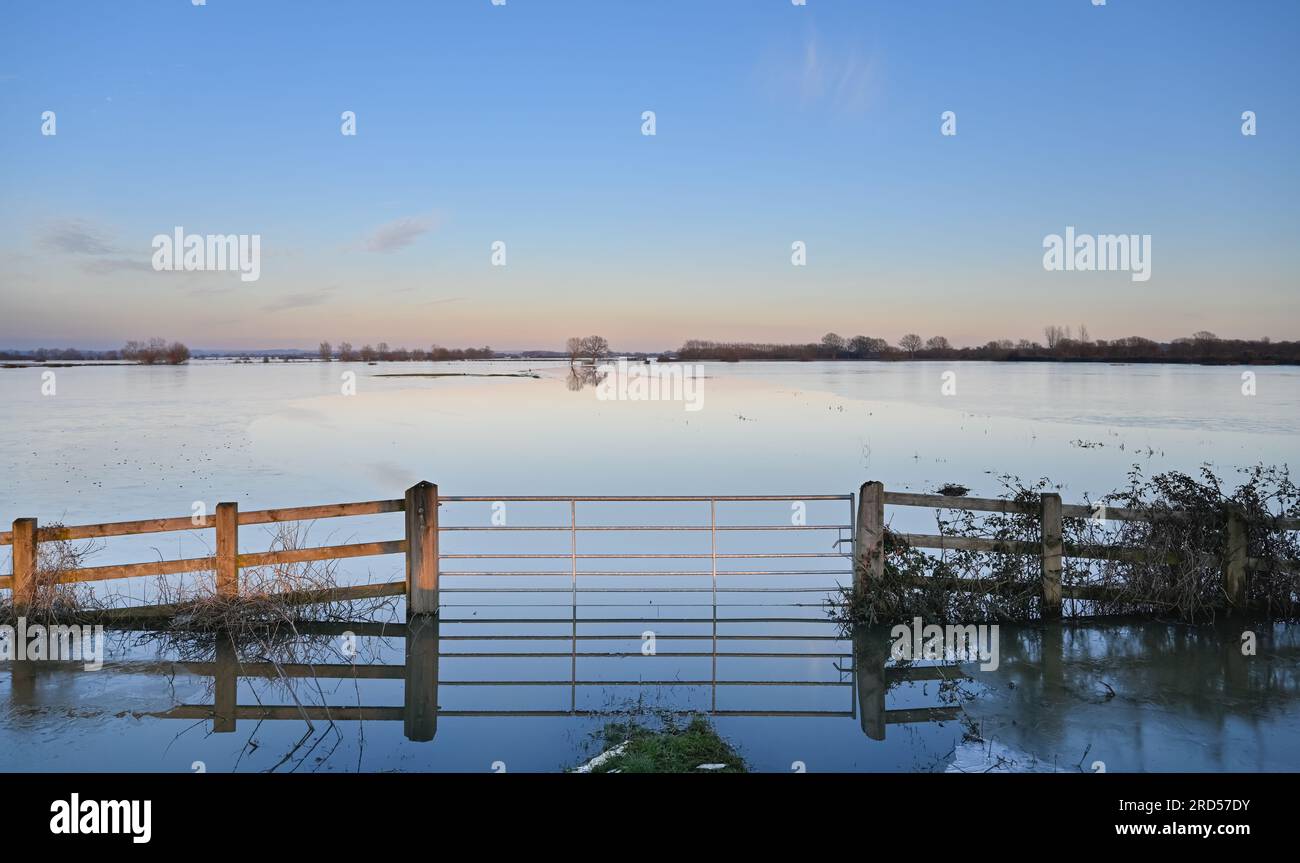 Gate to a submerged field which has frozen over Somerset Levels Near Burrow Hill and Highbridge Stock Photo