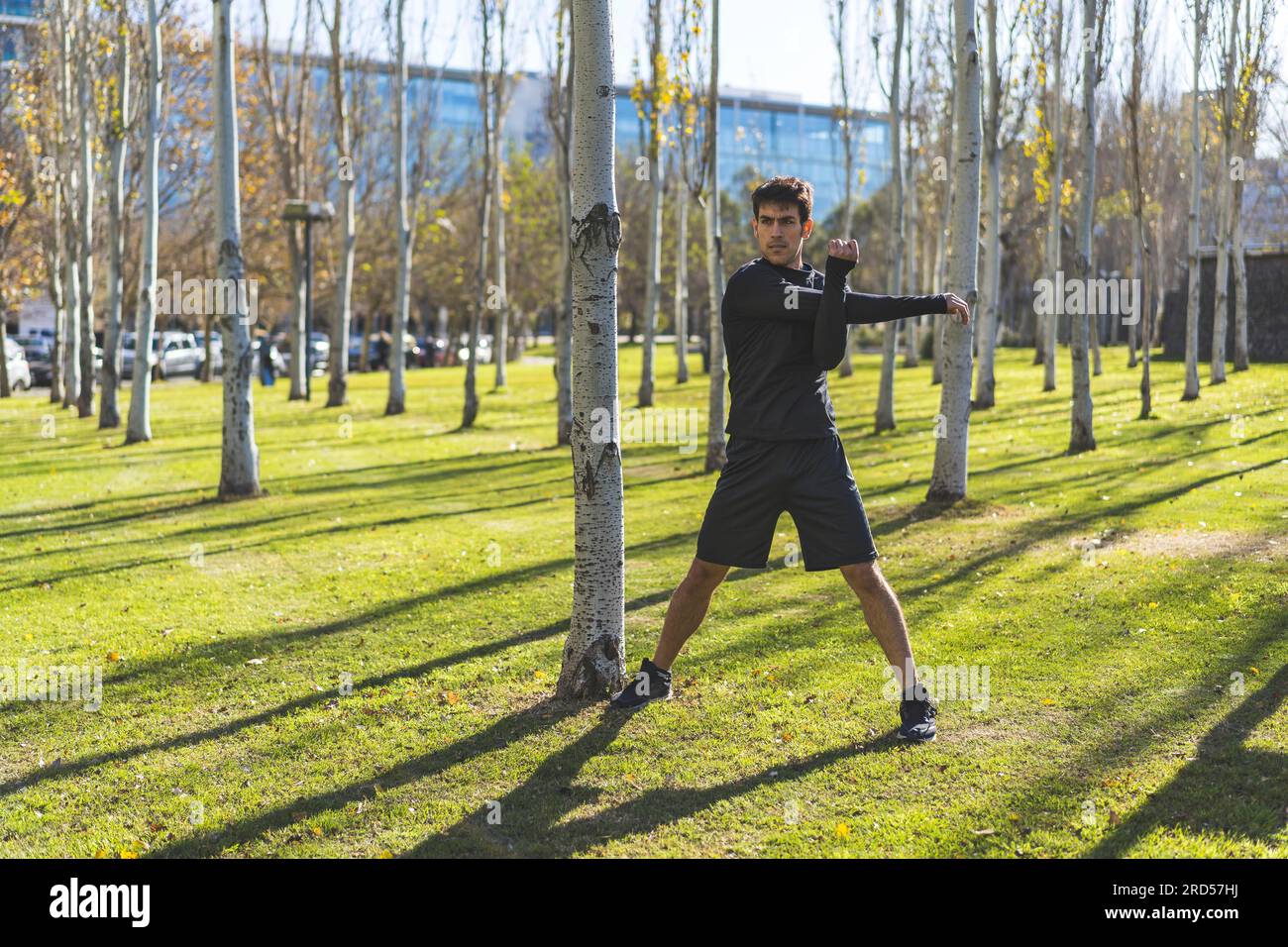 Handsome young man stretching hi-res stock photography and images - Alamy