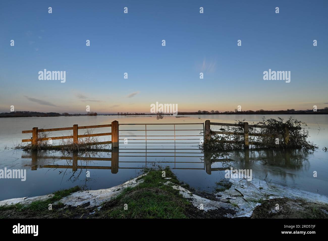 Gate to a submerged field which has frozen over Somerset Levels Near Burrow Hill and Highbridge Stock Photo