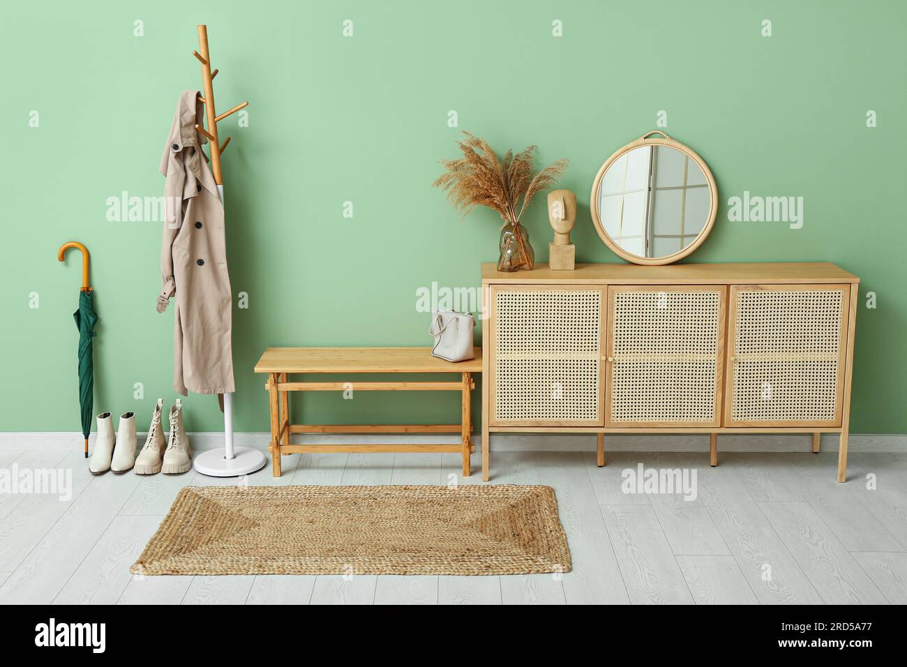 Interior of modern hall with bench, rack and drawers Stock Photo - Alamy