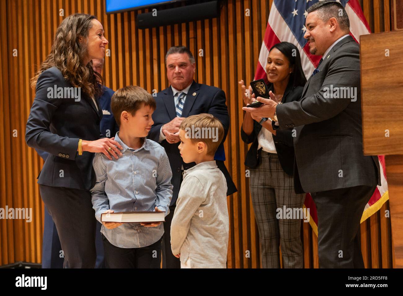 Edward Caban presents NYPD badge to Rebecca Weiner at public safety announcement by Mayor Eric Adams and Police Commissioner Edward Caban at NYPD Headquarters in New York on July 18, 2023 Stock Photo