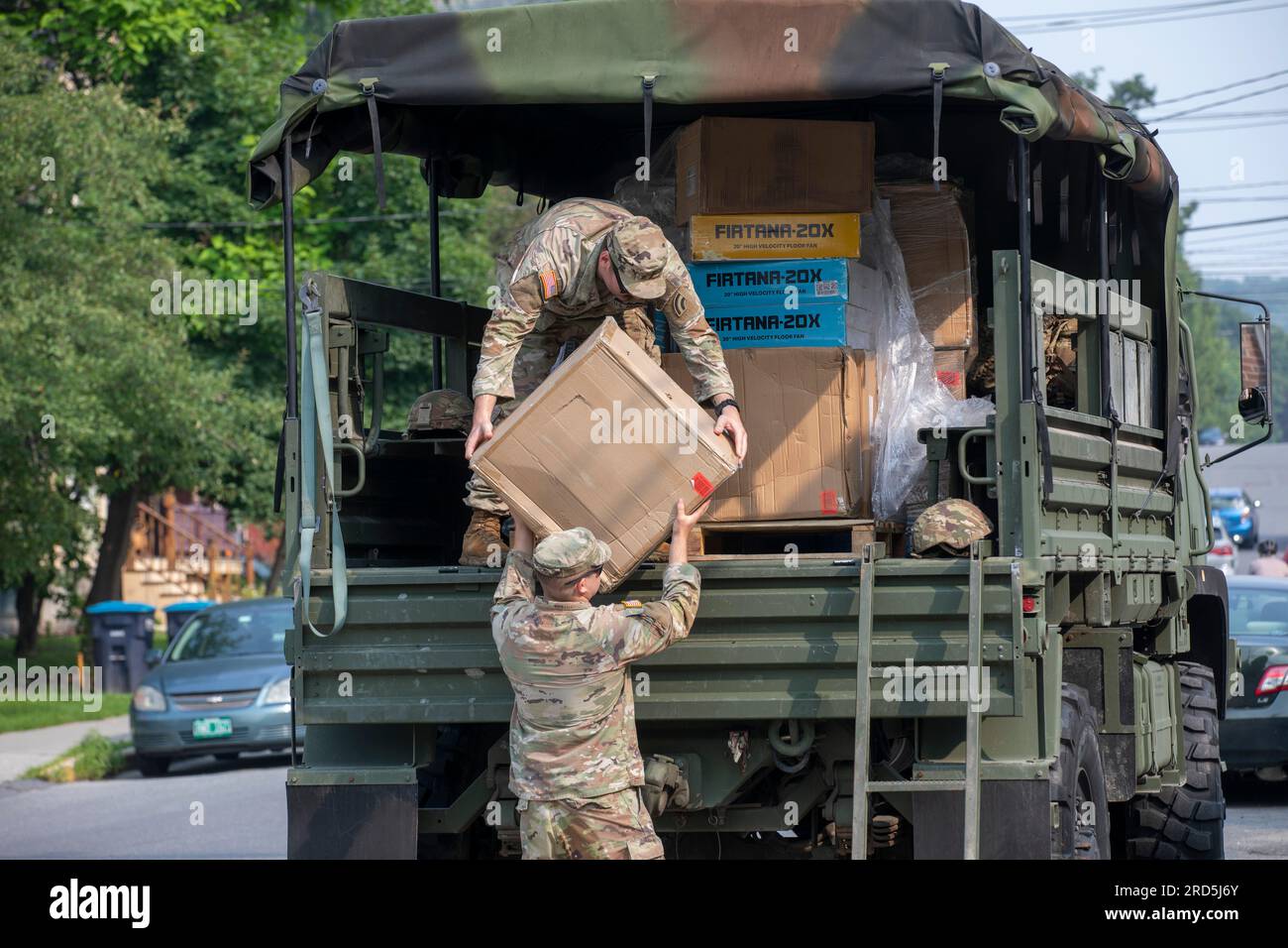 Hardwick, United States Of America. 17th July, 2023. Hardwick, United States of America. 17 July, 2023. U.S. Army Spc. Ryan Spodick, above, and Pfc. David Cross, below, with the Vermont Army National Guard unload donated electric fans in the aftermath of floods, July 17, 2023 in Hardwick, Vermont. Soldiers helped organize and distribute donated items to towns affected by flooding across Vermont. Credit: Sgt. Denis Nunez/U.S. Army Photo/Alamy Live News Stock Photo